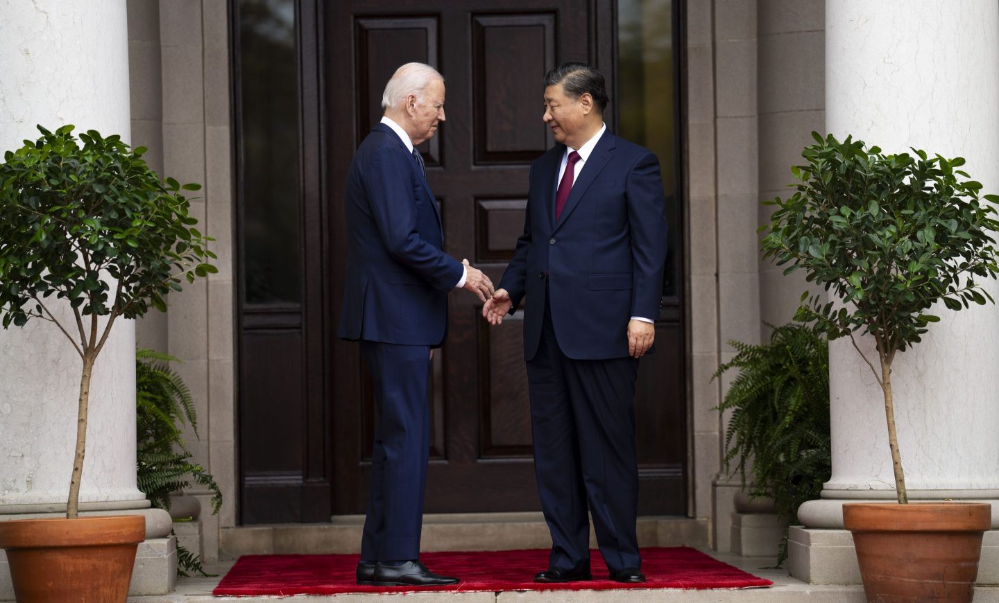 U.S. President Joe Biden and Chinese President Xi Jinping shaking hands