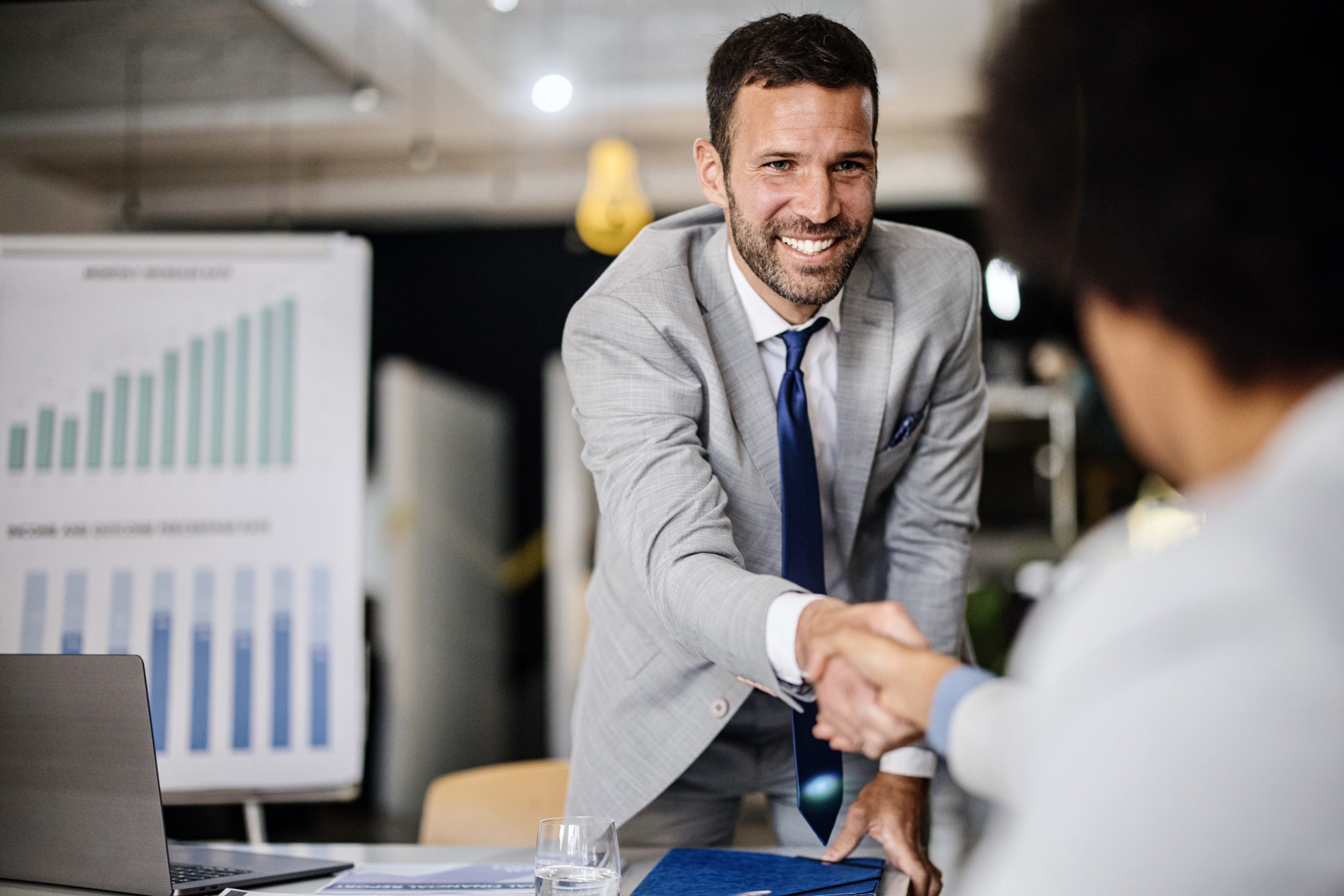 A business executive shaking hands.