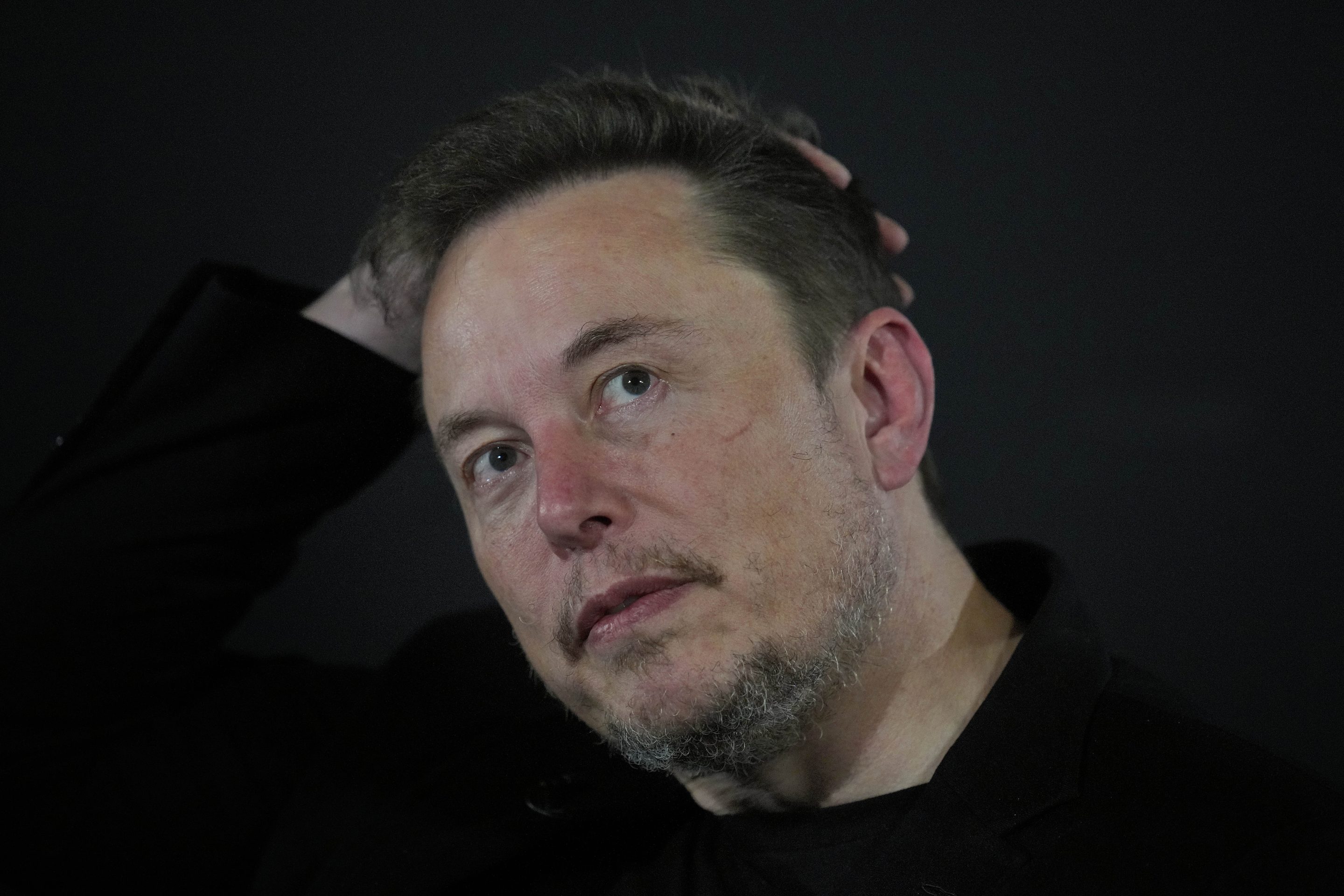 Elon Musk faces criticism after engaging with anti-Semitic post on X.