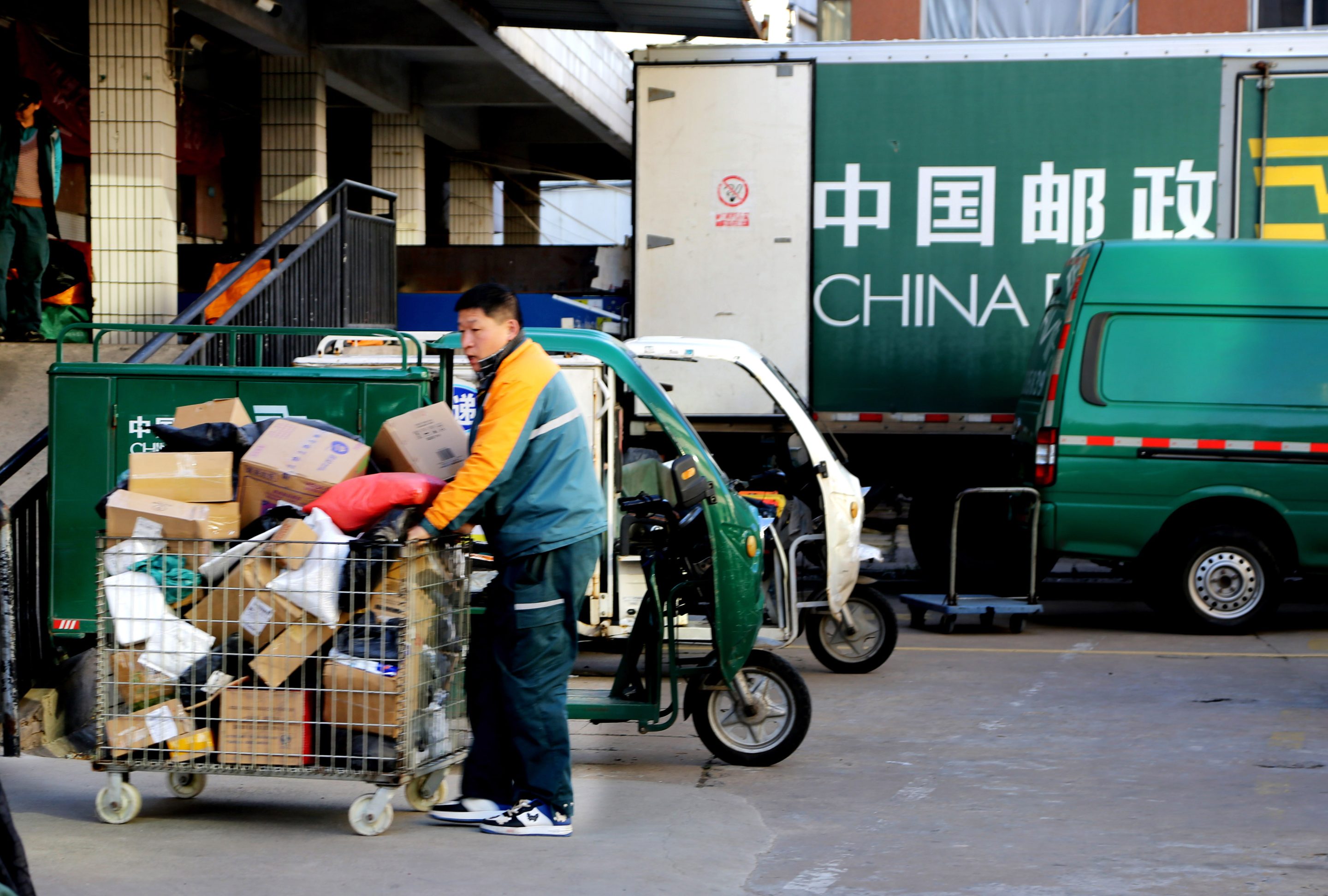 A postman sorts parcels at the Postal Express logistics business department in Lianyungang, Jiangsu province, China on Nov. 12, 2023. Chinese postal companies handled 600 million packages on Singles Day this year.