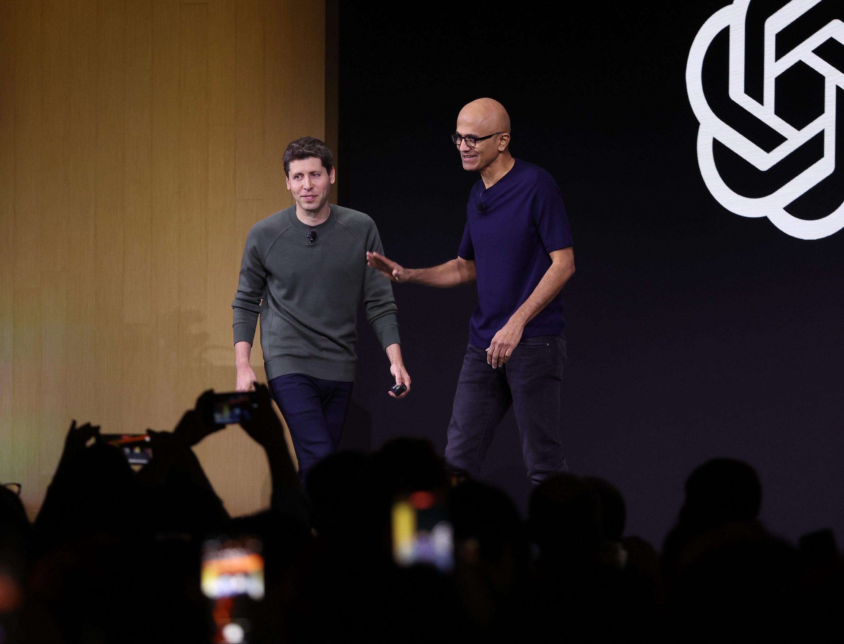 Microsoft CEO Satya Nadella (right) is not ready to let go of OpenAI founder Sam Altman (left)