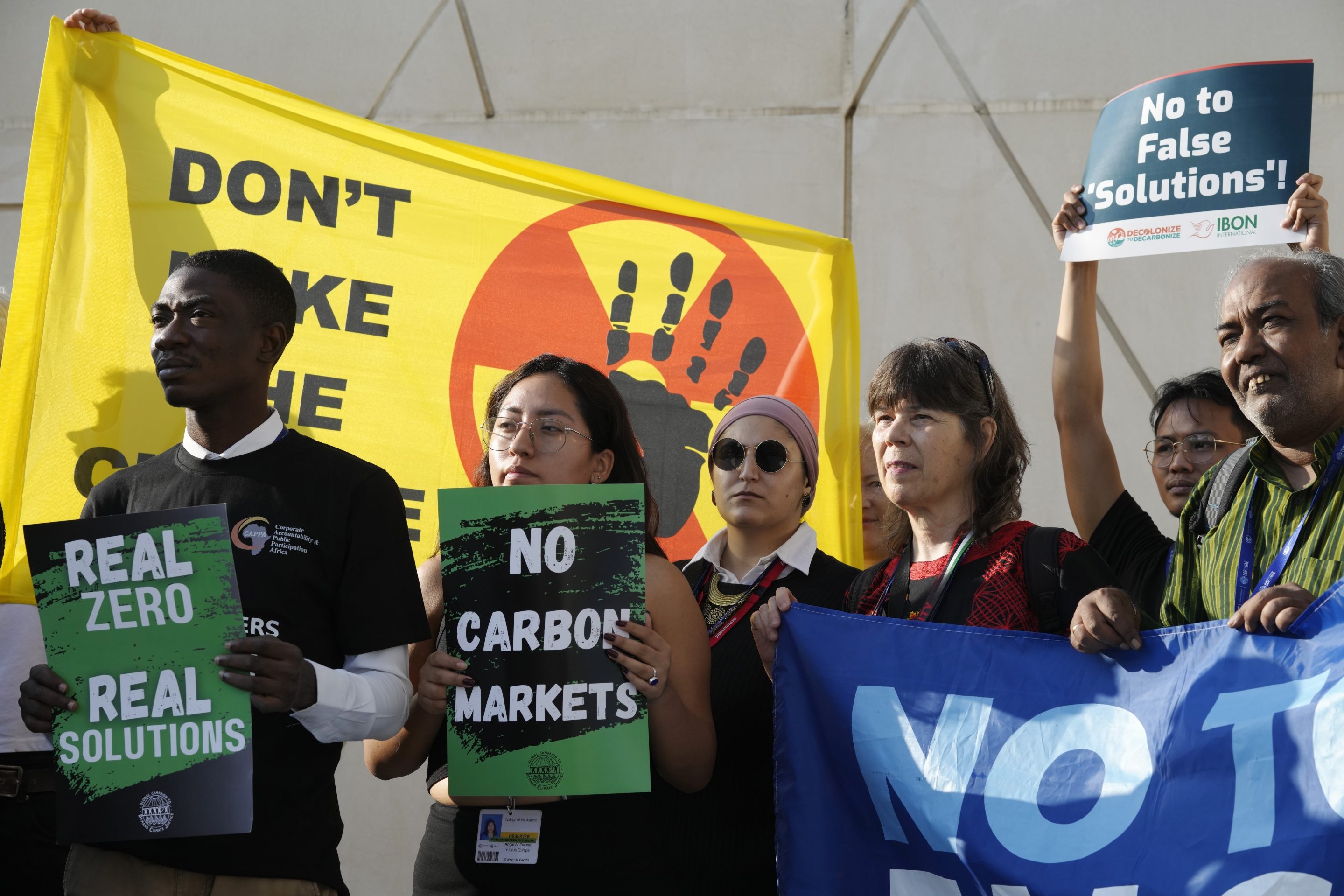 Activists participate in a demonstration at the COP28 U.N. Climate Summit, Dec. 8, 2023, in Dubai, United Arab Emirates.
