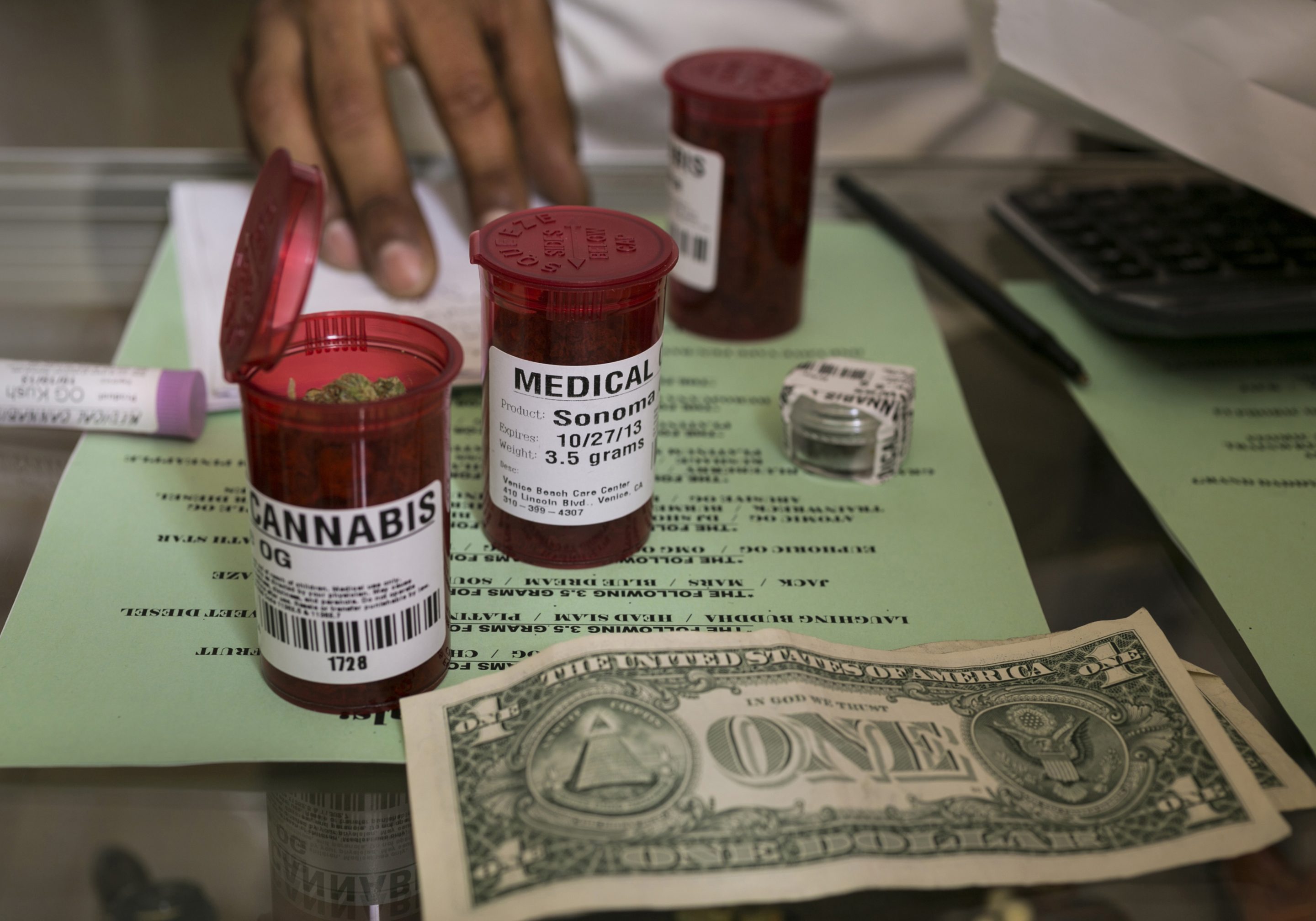 Medical marijuana prescription vials are filled at a medical marijuana dispensary in Venice, Calif., May 14, 2013. 