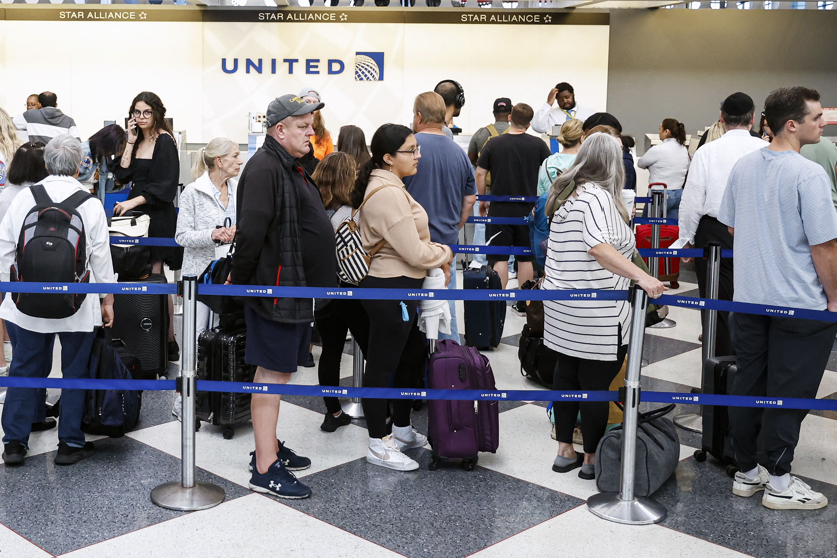 Travelers arrive at O’Hare International Airport on June 30, 2023, in Chicago.