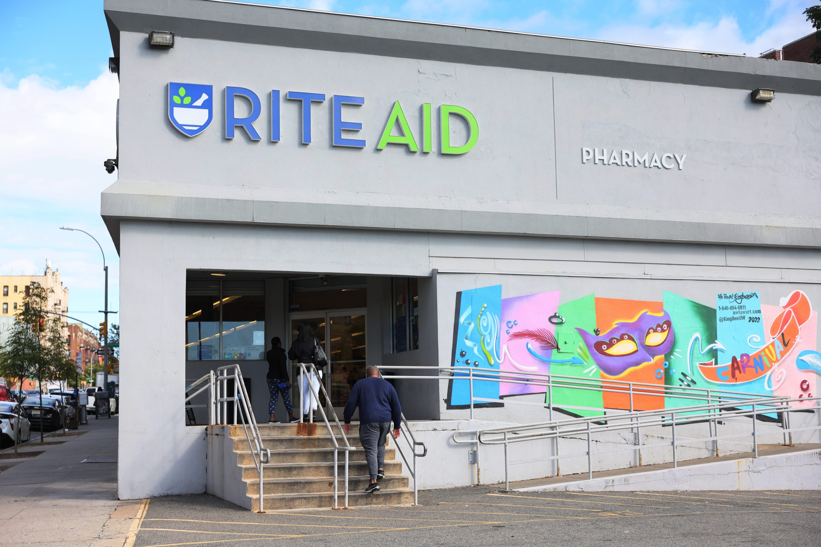 People enter a Rite-Aid on October 16, 2023 in the Crown Heights neighborhood of the Brooklyn borough of New York City.