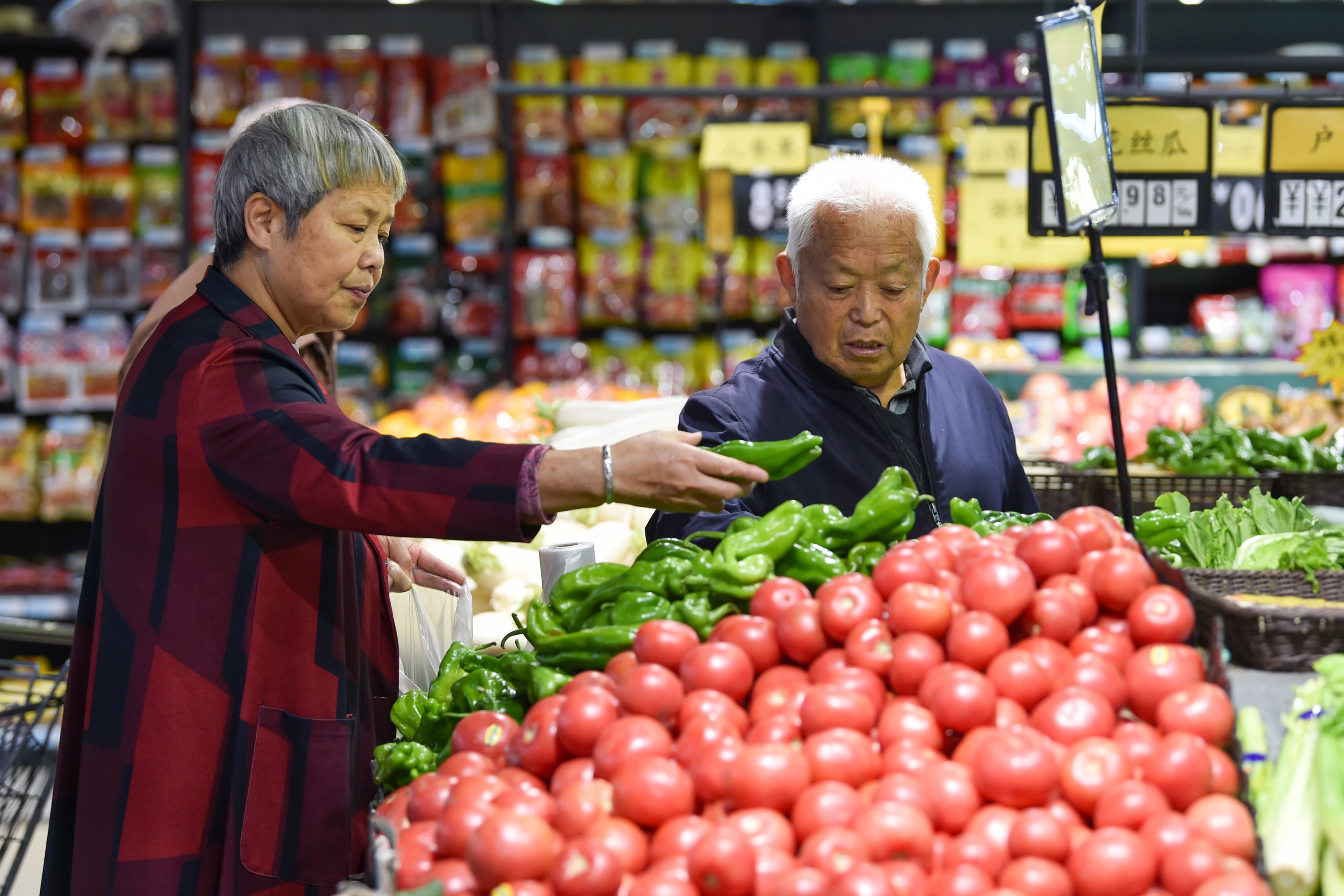 Customers shop at a supermarket in Nanjing, East China's Jiangsu Province, last month.