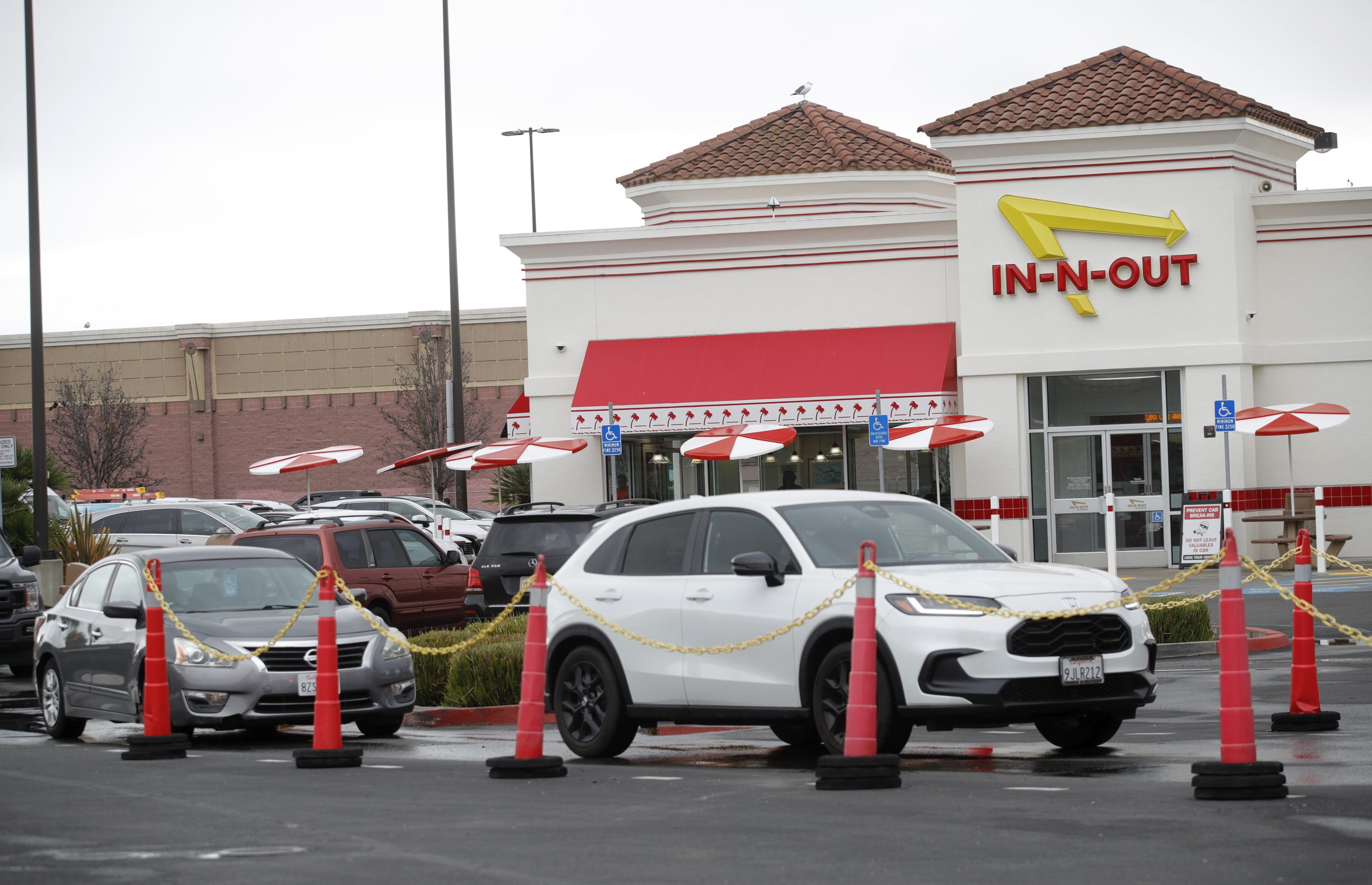 Customers line up at the In-N-Out drive-thru off Hegenberger Road in Oakland, Calif., on Monday.