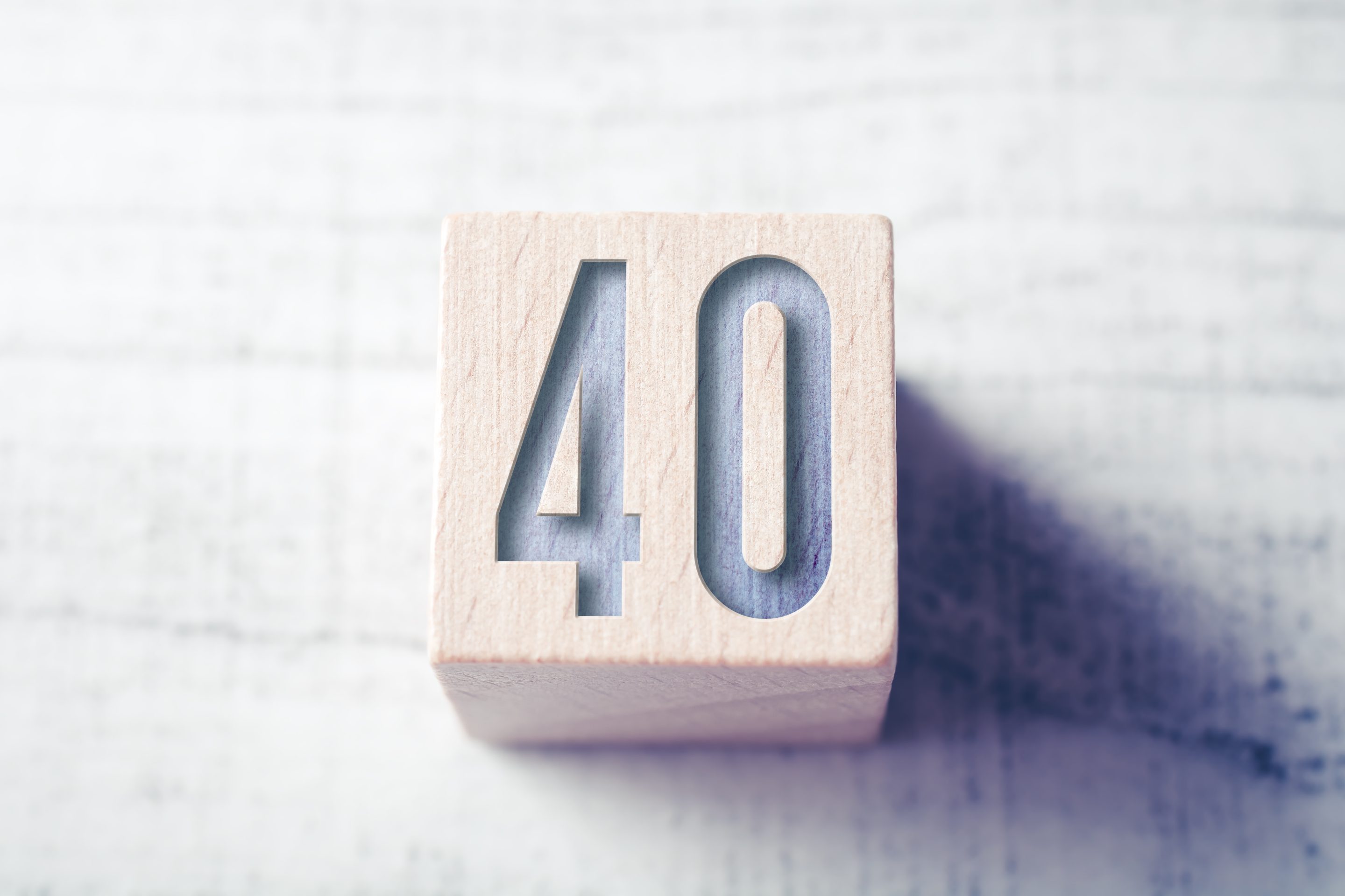 The number 40 on a wooden block.