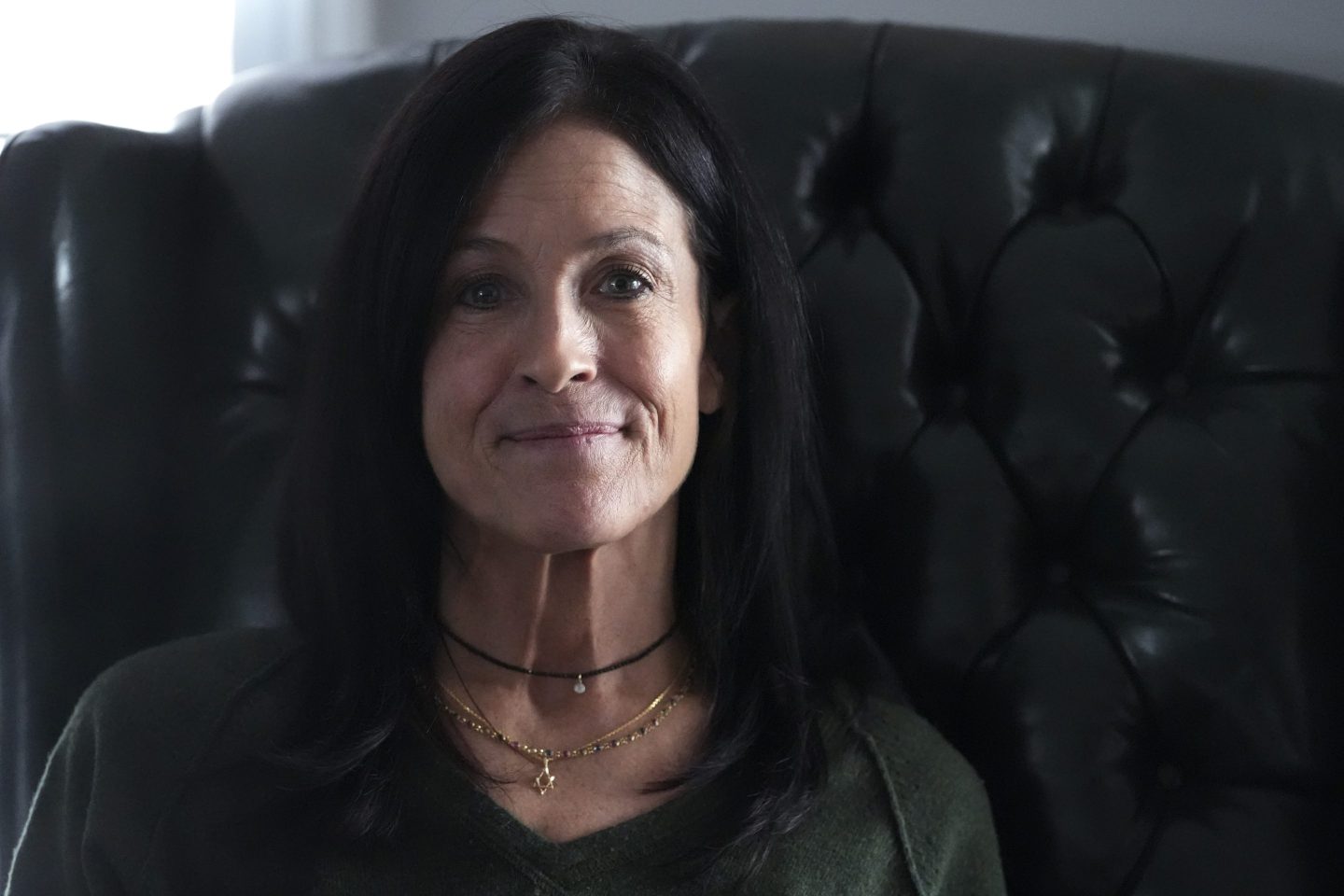 Jill Feldman, 54, poses for a photo at her home in Deerfield, Ill., on Jan. 19. Lung cancer patient and advocate Jill Feldman takes pills at home that shrink tumors by blocking a signal that tells cancer cells to grow.