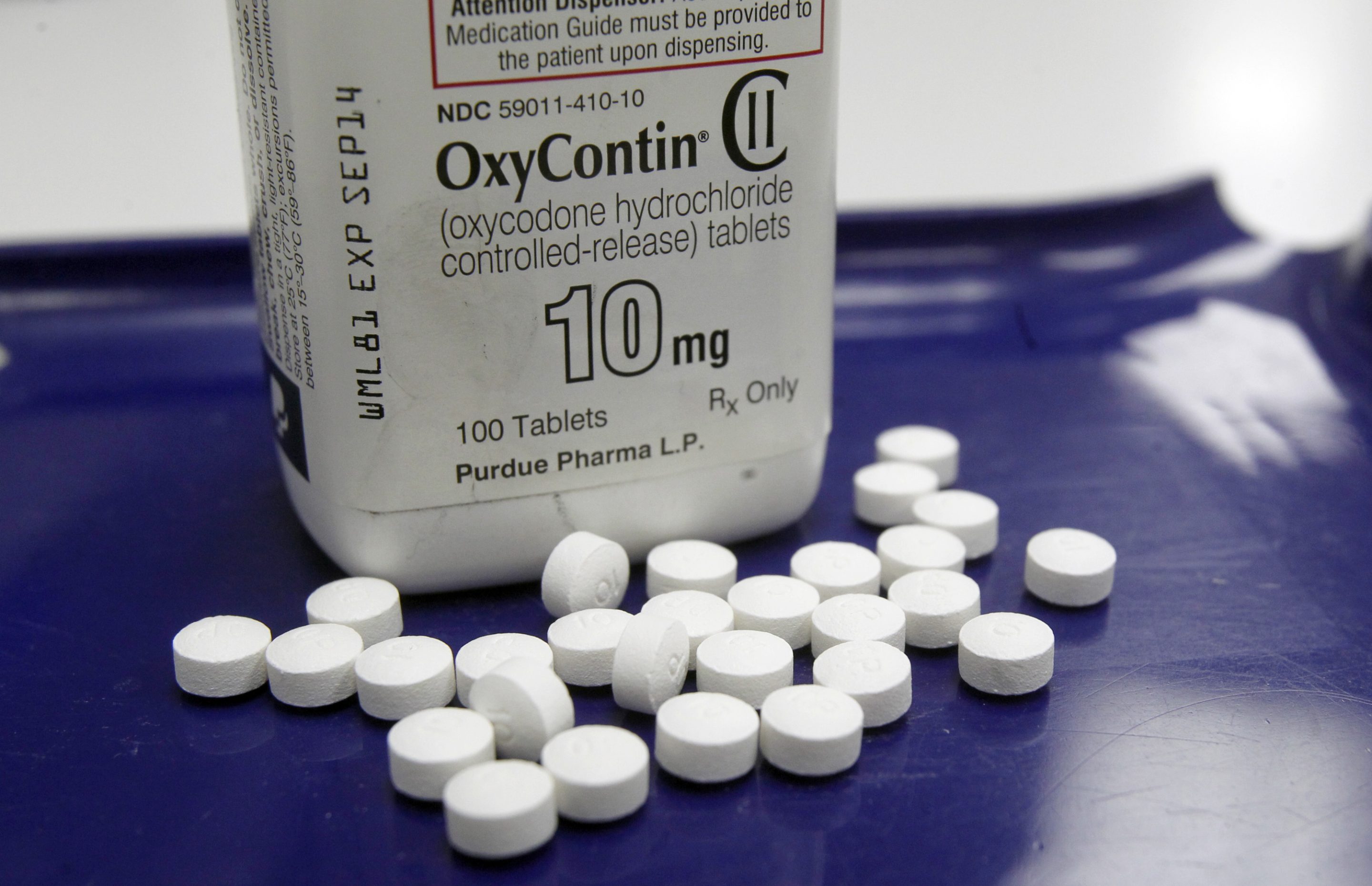 An advertising agency that helped develop marketing campaigns for OxyContin and other prescription painkillers and a drugmaker announced agreements worth a total of $500m.