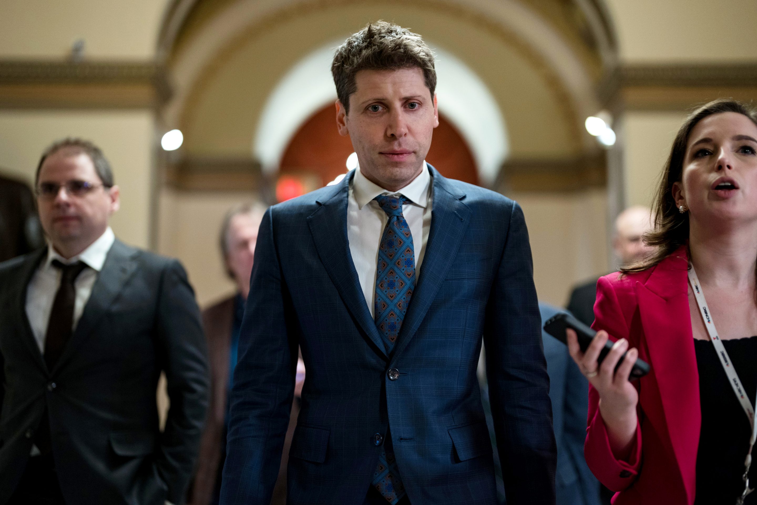OpenAI CEO Sam Altman walking in the U.S. Capitol