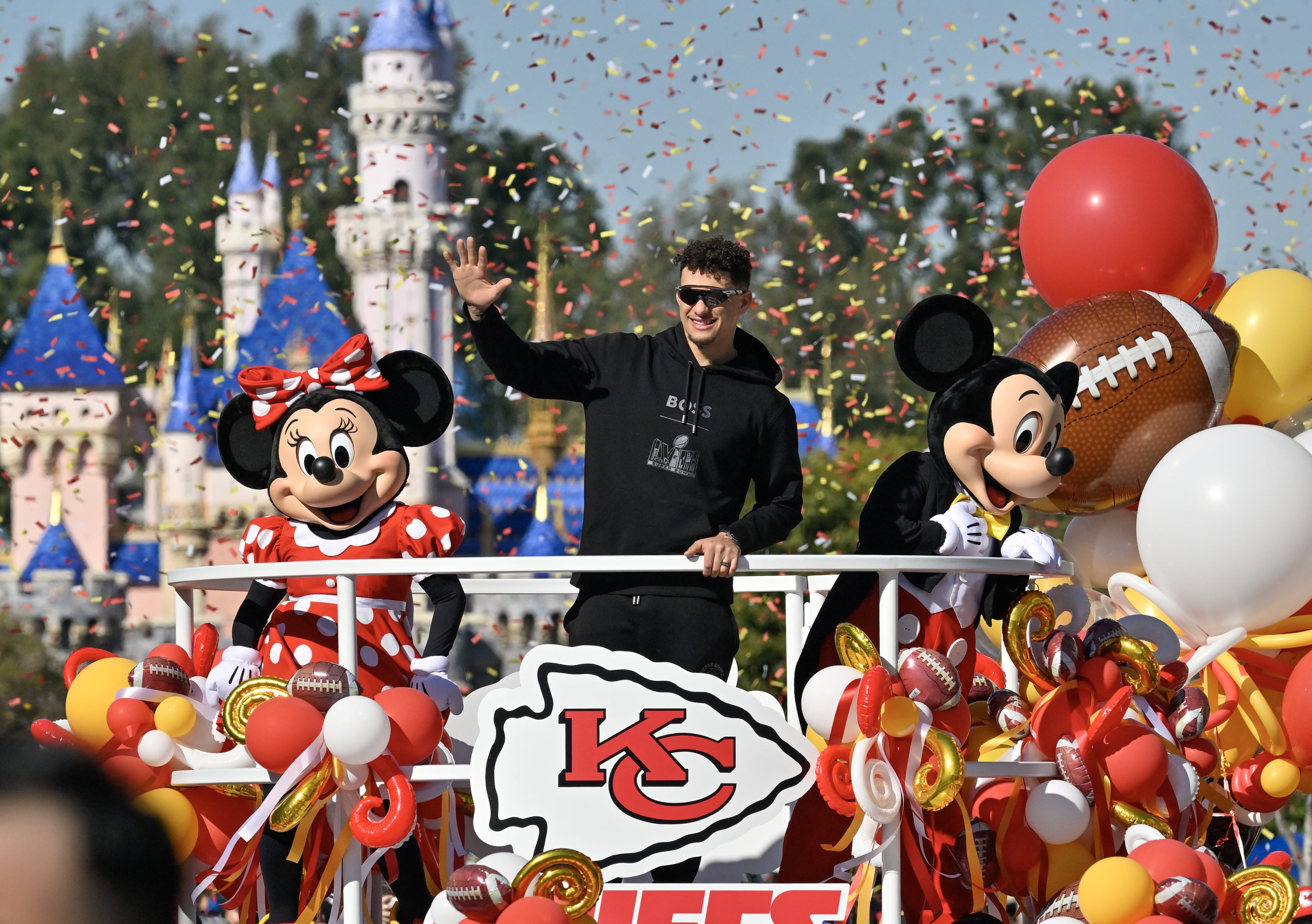 Super Bowl LVIII MVP, Kansas City Chiefs quarterback Patrick Mahomes, greets fans on Main Street., U.S.A, during a cavalcade through Disneyland in Anaheim, Calif., on Feb. 12, 2024.