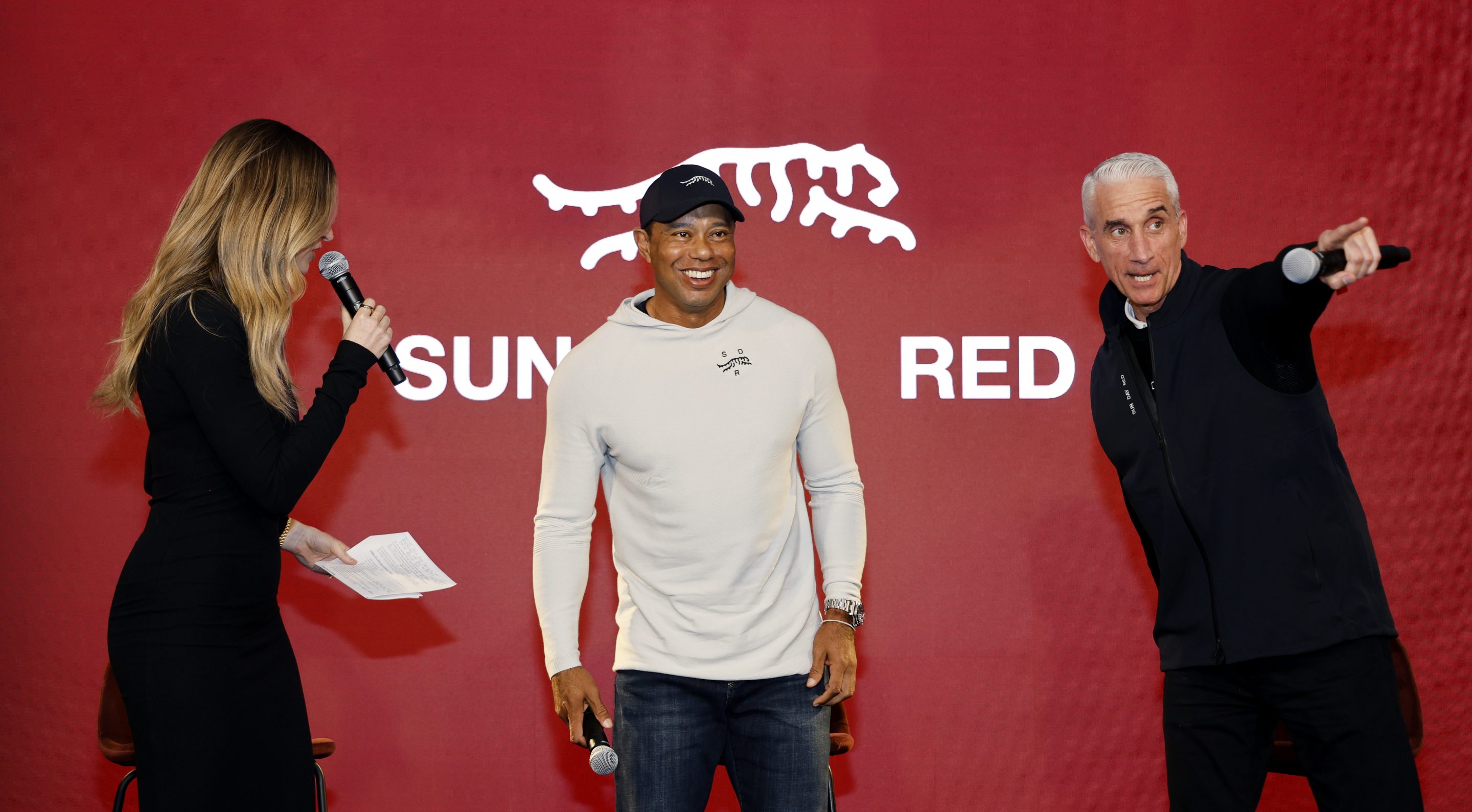 Erin Andrews, Tiger Woods and CEO and President at TaylorMade, David Abeles attend the launch of Tiger Woods and TaylorMade Golf's new apparel and footwear brand "Sun Day Red" at Palisades Village on Feb. 12, 2024 in Pacific Palisades, Calif. 