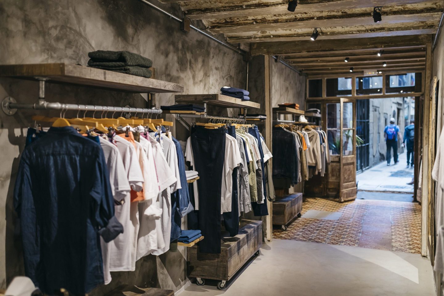 a row of shirts lined in a store