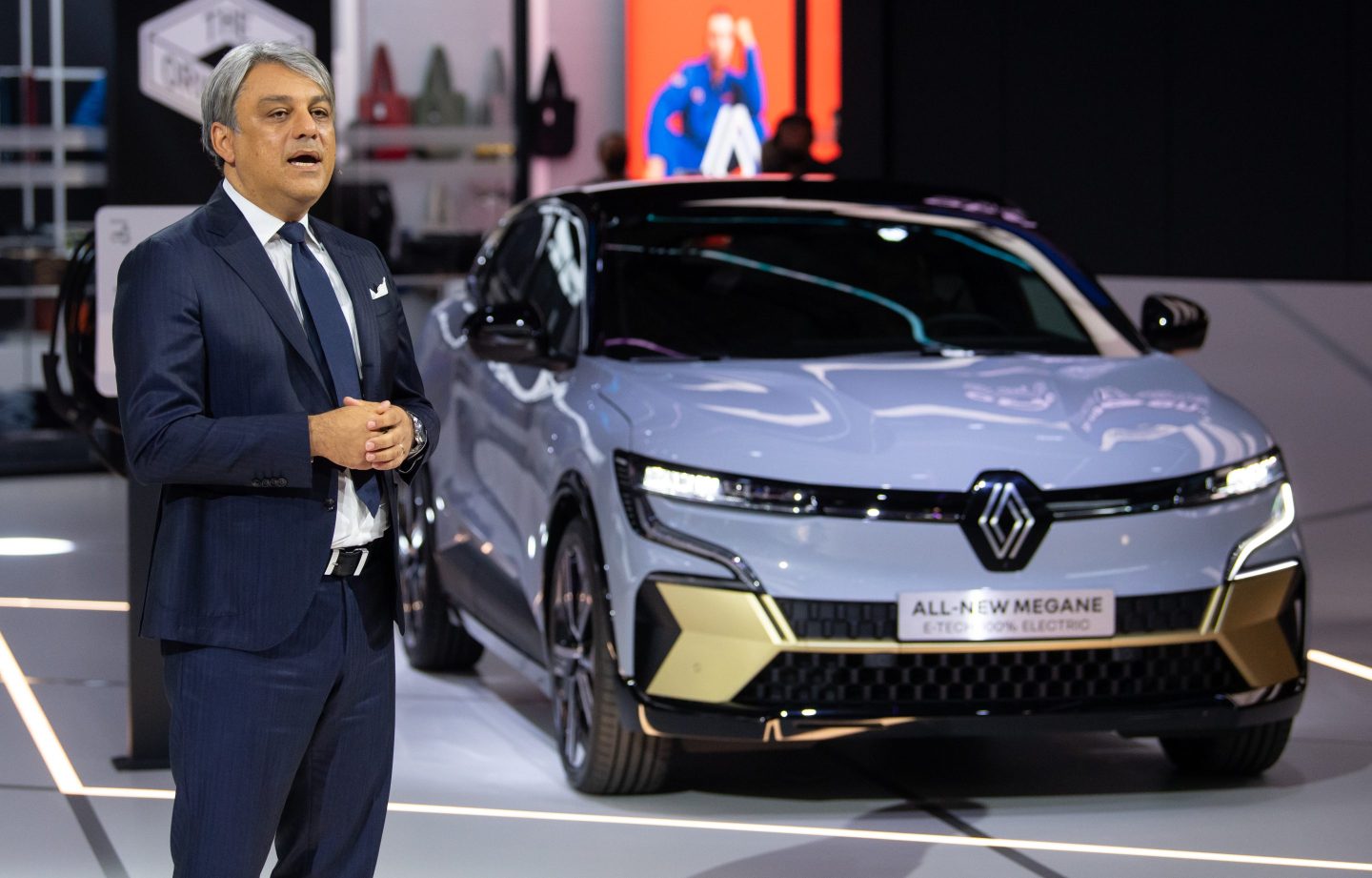 Luca de Meo, CEO of Renault, presents the "Megane E-Tech" at the Renault stand before the start of the International Motor Show