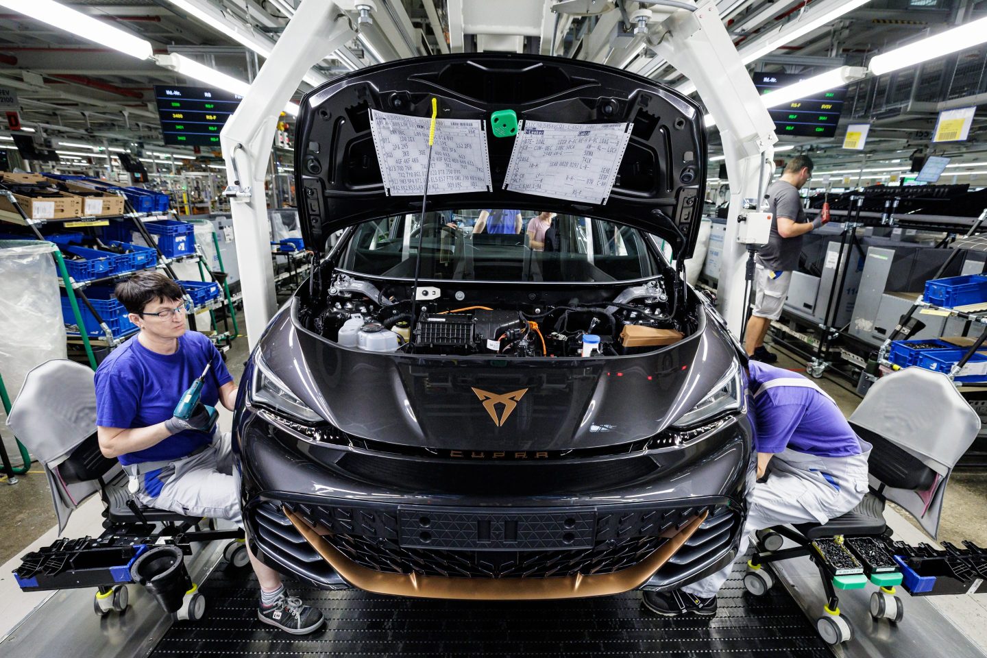 Workers assemble the Cupra Born electric car from automaker Volkswagen