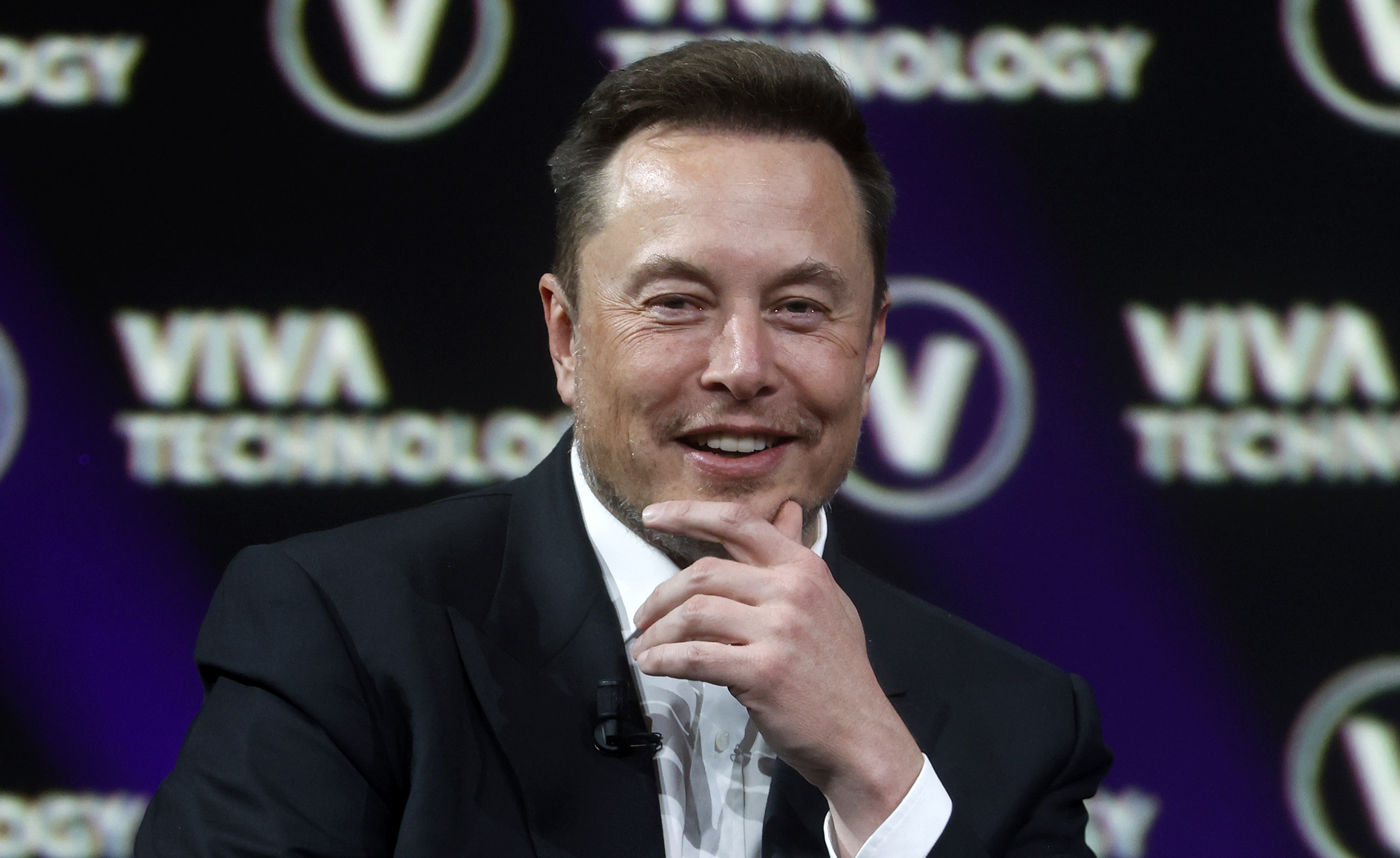 X CEO Elon Musk with his hand on his chin
