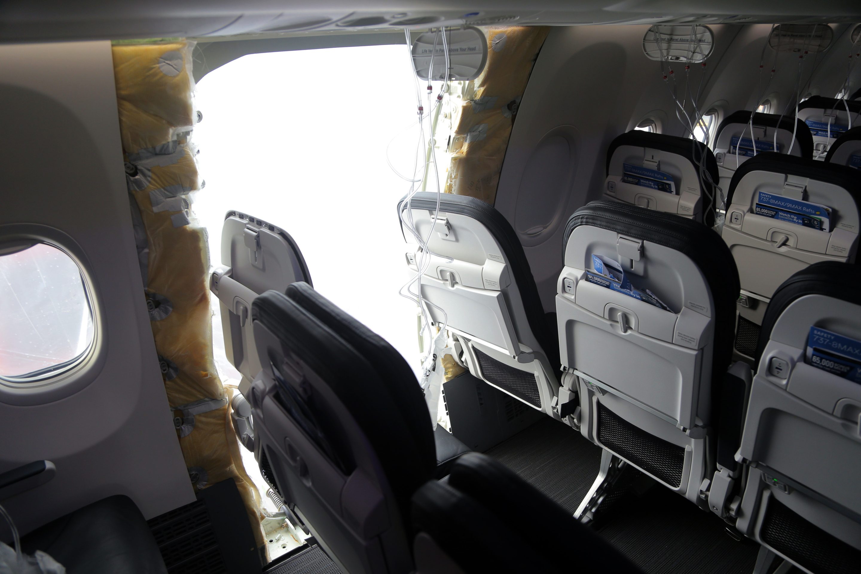 an opening is seen in the fuselage of Alaska Airlines Flight 1282 Boeing 737-9 MAX