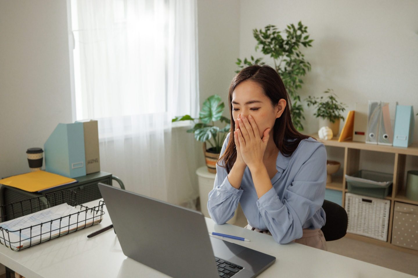 Woman concerned at her laptop