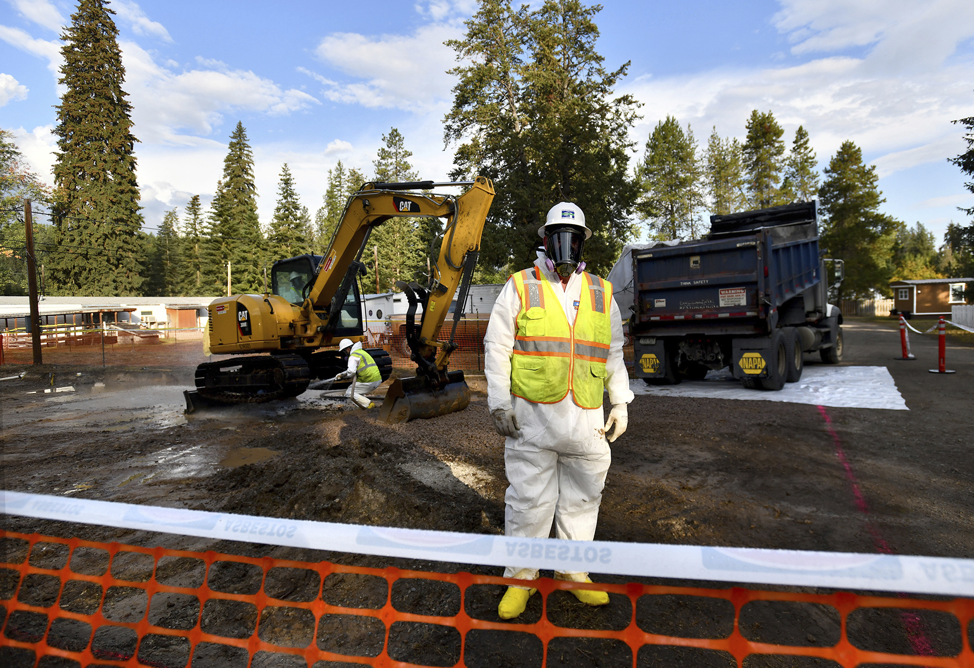 Environmental cleanup specialists work at one of the last remaining residential asbestos cleanup sites in Libby, Montana, in mid-September.