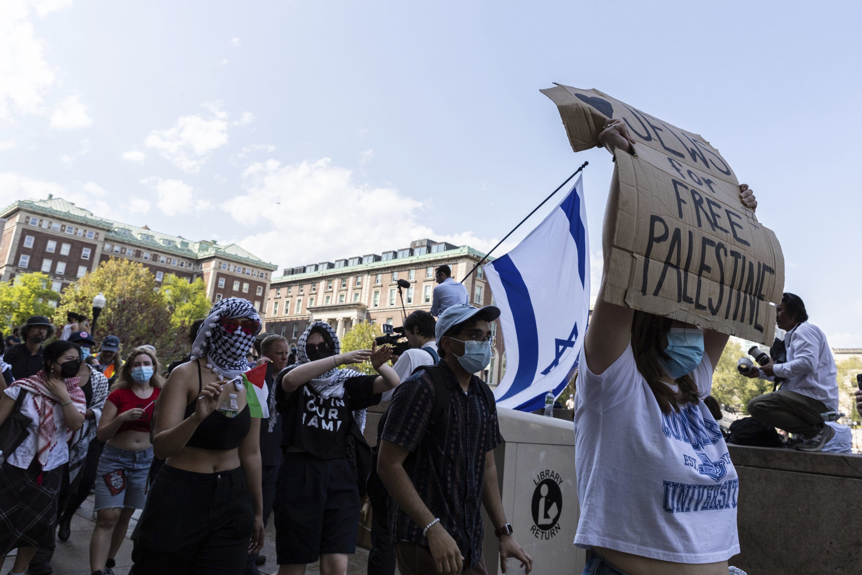 Student protesters march round their encampment on the Columbia University campus, on April 29, 2024, in New York. 