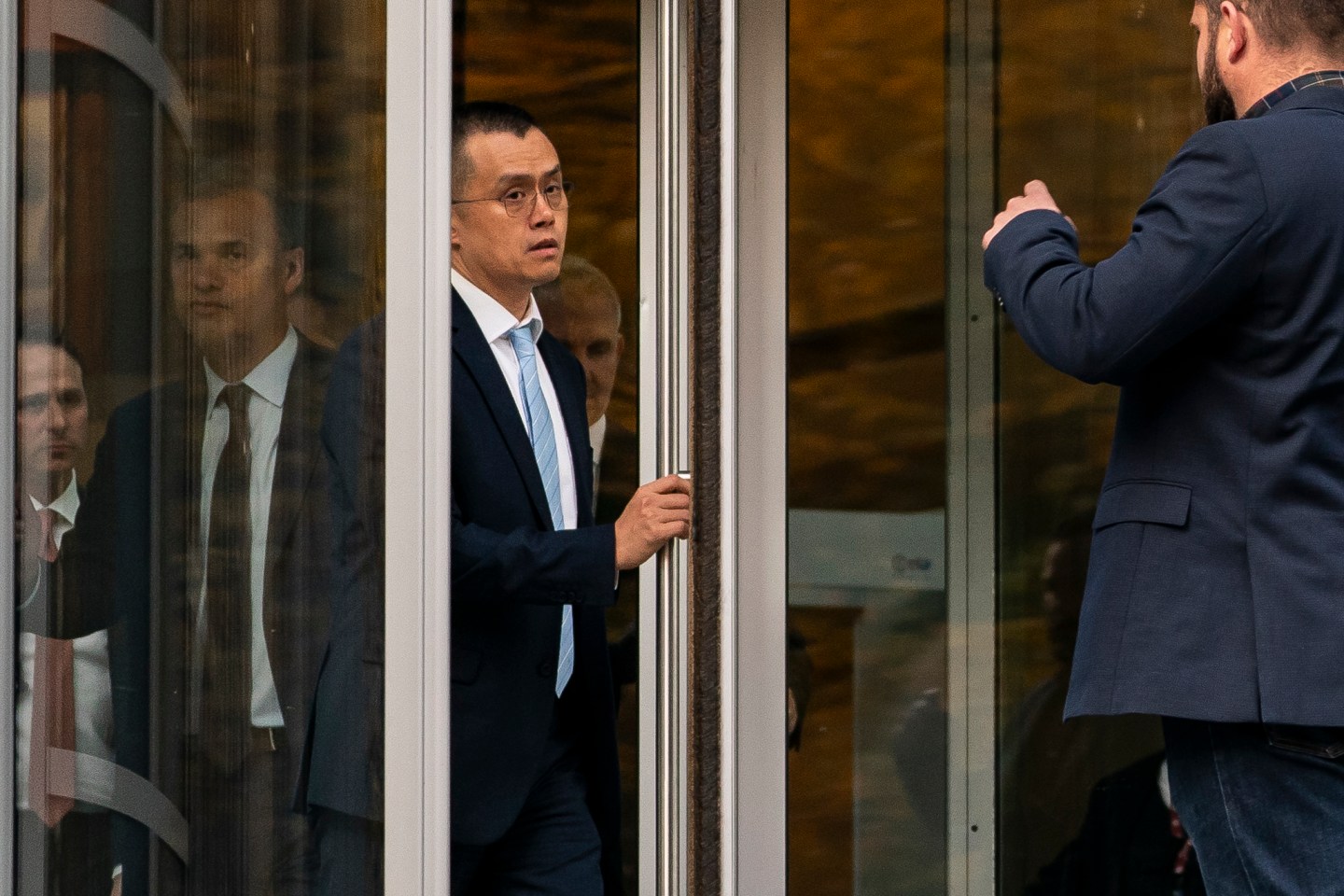 Former Binance CEO Changpeng Zhao leaves the U.S. District Court in Seattle on Nov. 21, 2023.