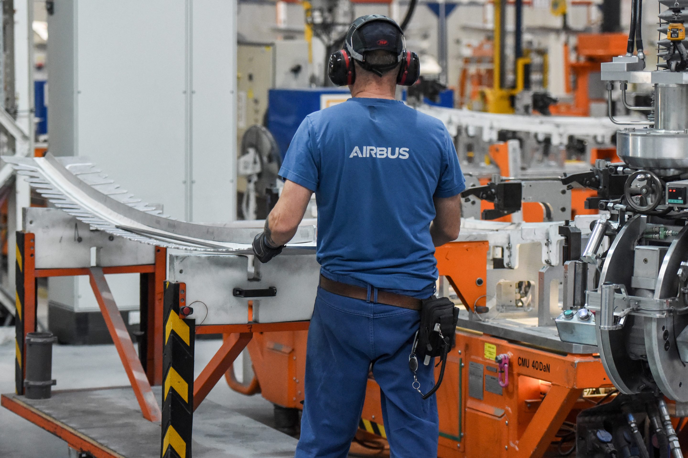 An Airbus employee works on an aircraft part of the Airbus A350 near Nantes, western France, on Feb. 29.