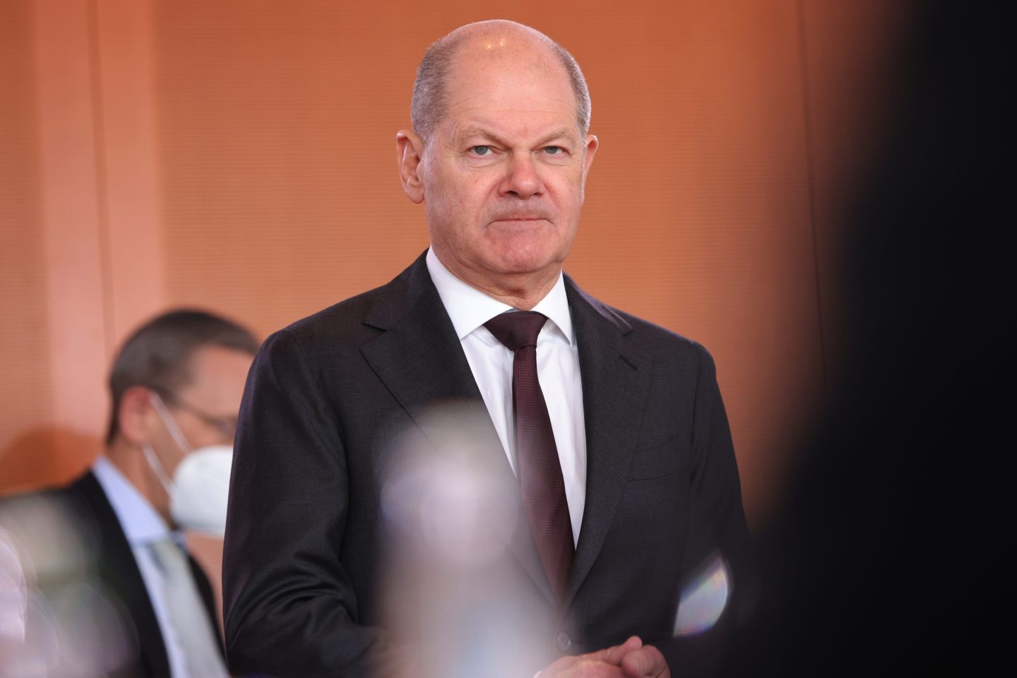 person standing in a suit
