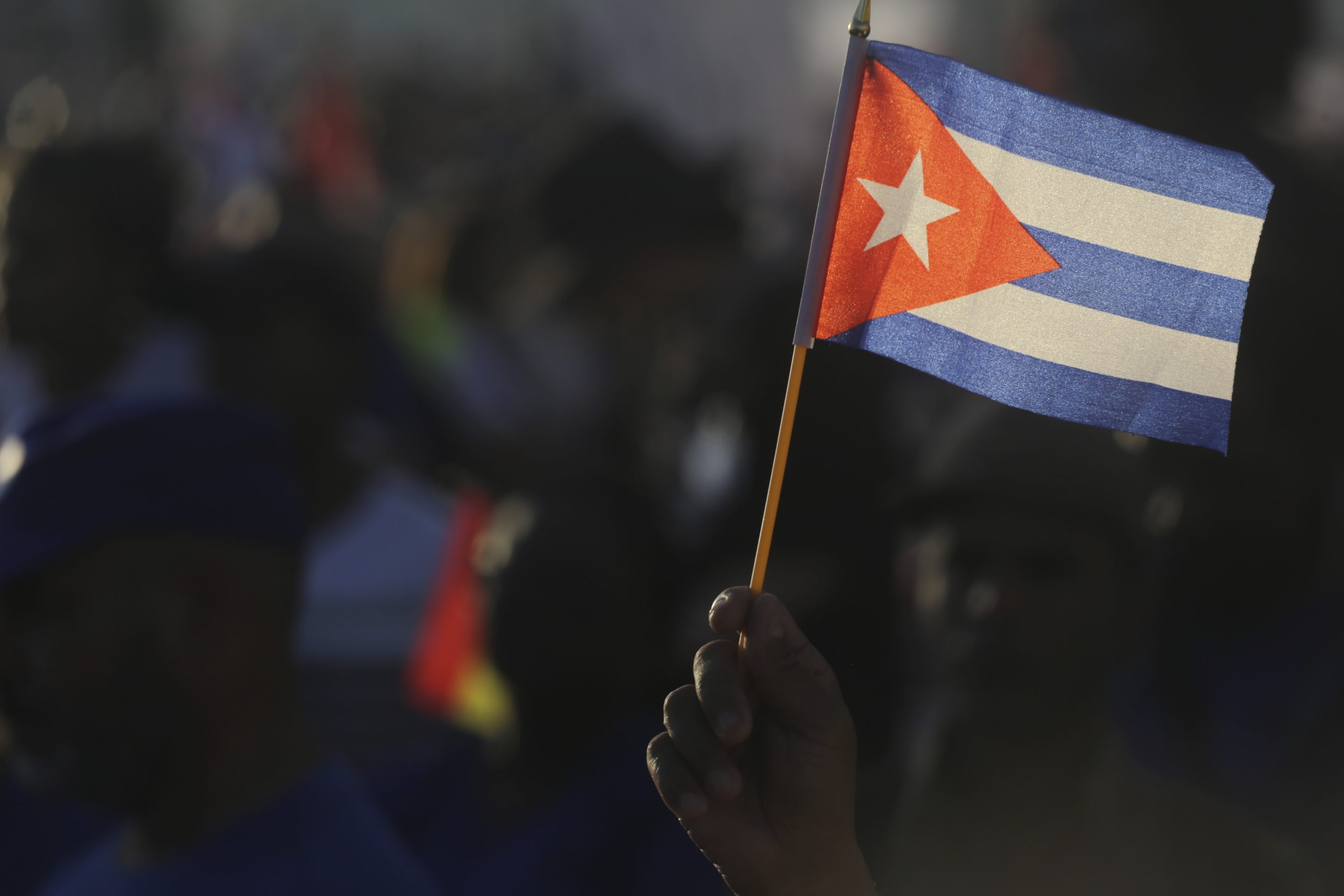 A person waves a Cuban flag during a gathering marking International Workers' Day at Jose Marti
Anti-Imperialist Square in Havana, Cuba, on May 1, 2024.