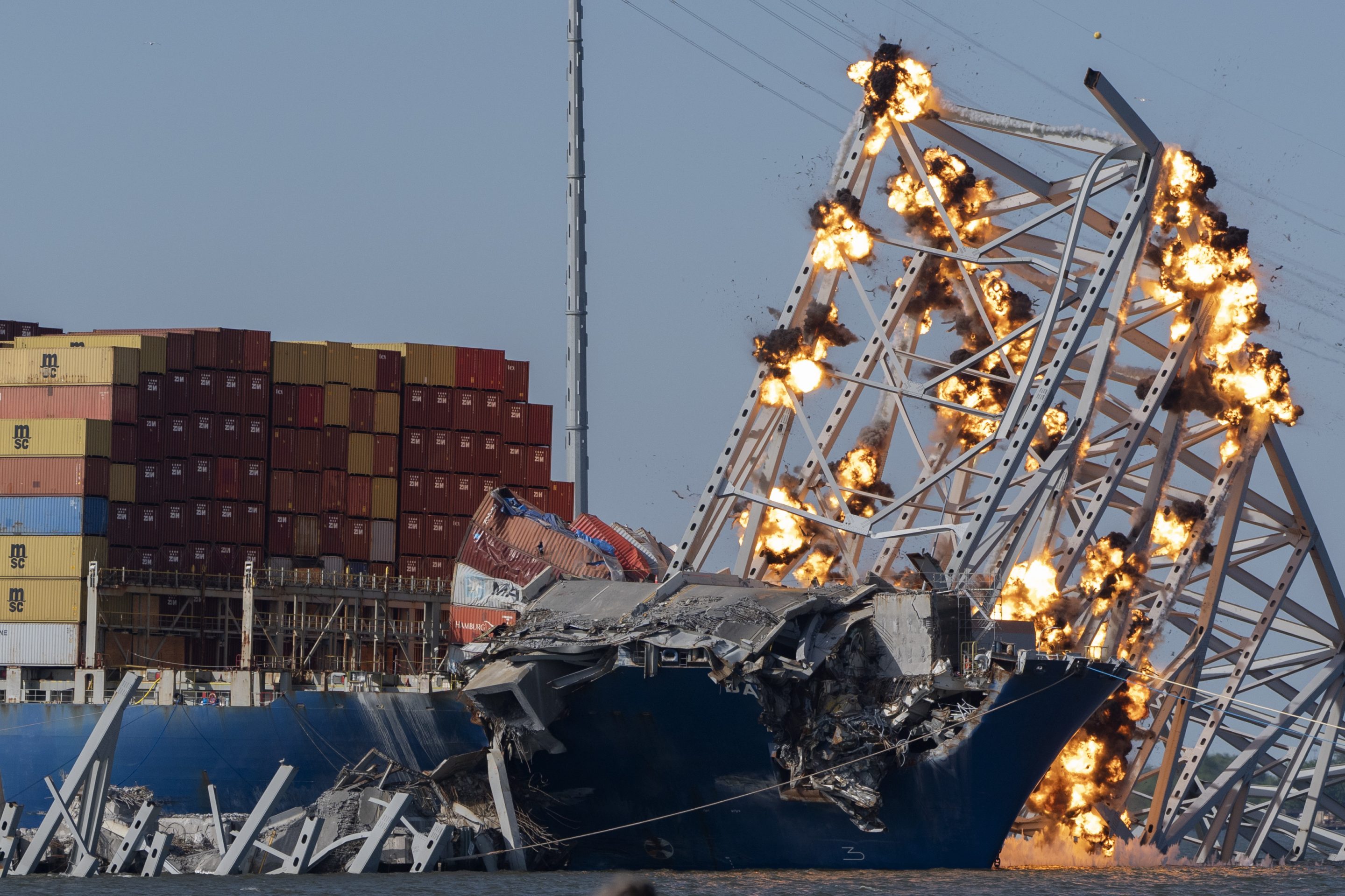 Controlled explosions light up collapsed Francis Scott Key Bridge on Monday.