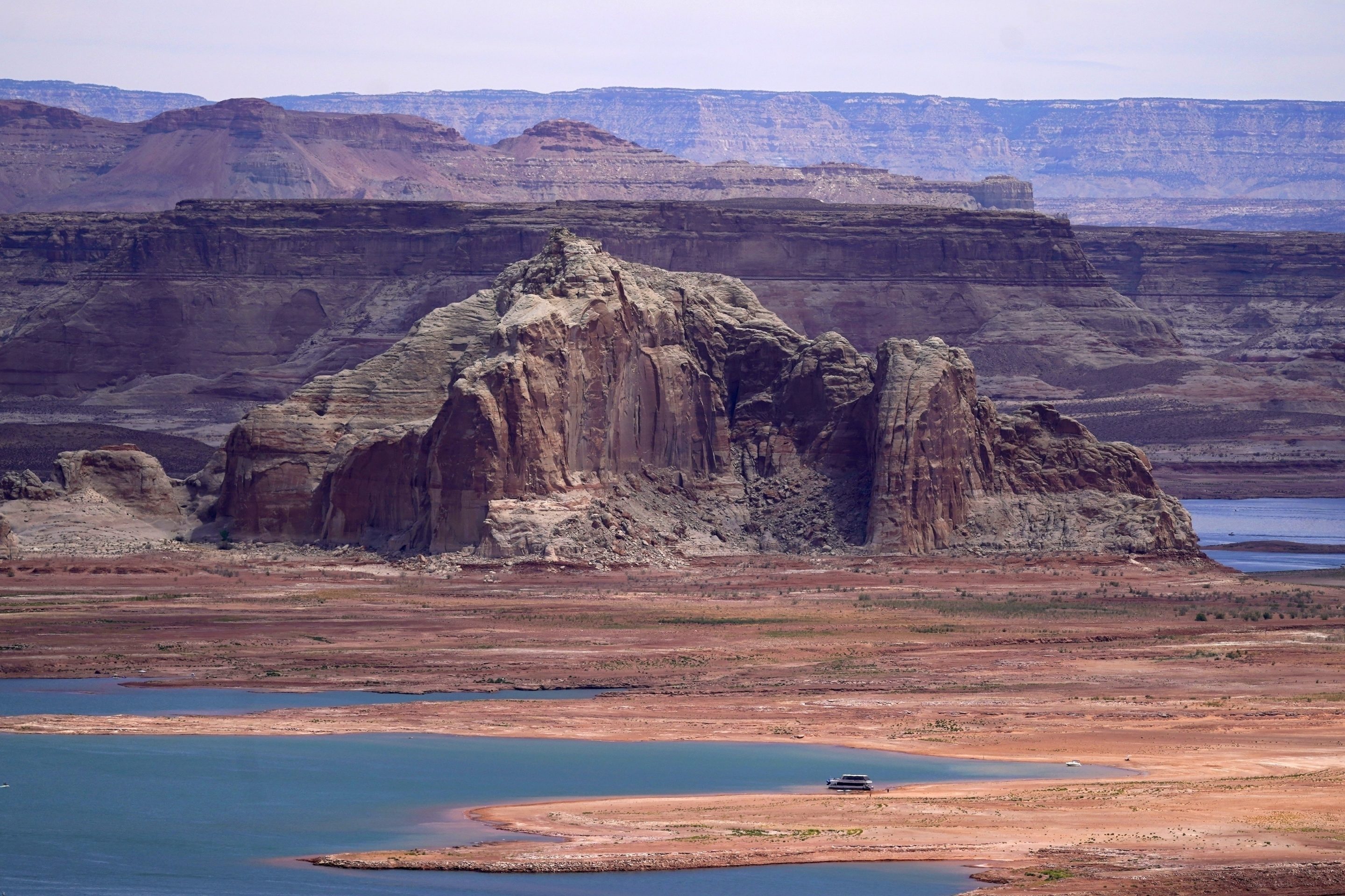 Low water levels at Wahweap Bay at Lake Powell along the Upper Colorado River Basin are pictured, June 9, 2021, at the Utah and Arizona border at Wahweap, Ariz.