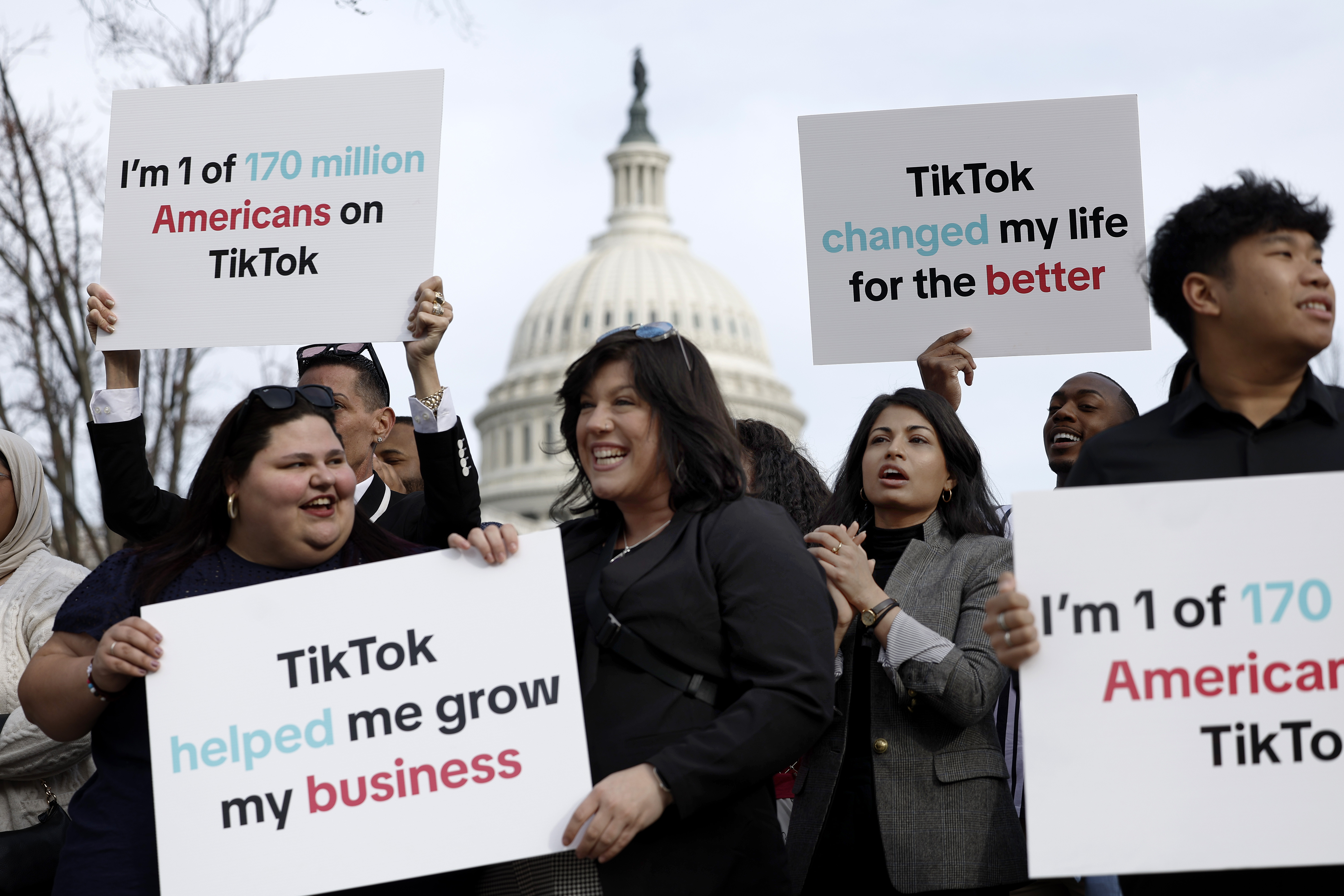 Participants hold signs in support of TikTok outside the U.S. Capitol Building on March 13, 2024 in Washington, D.C.