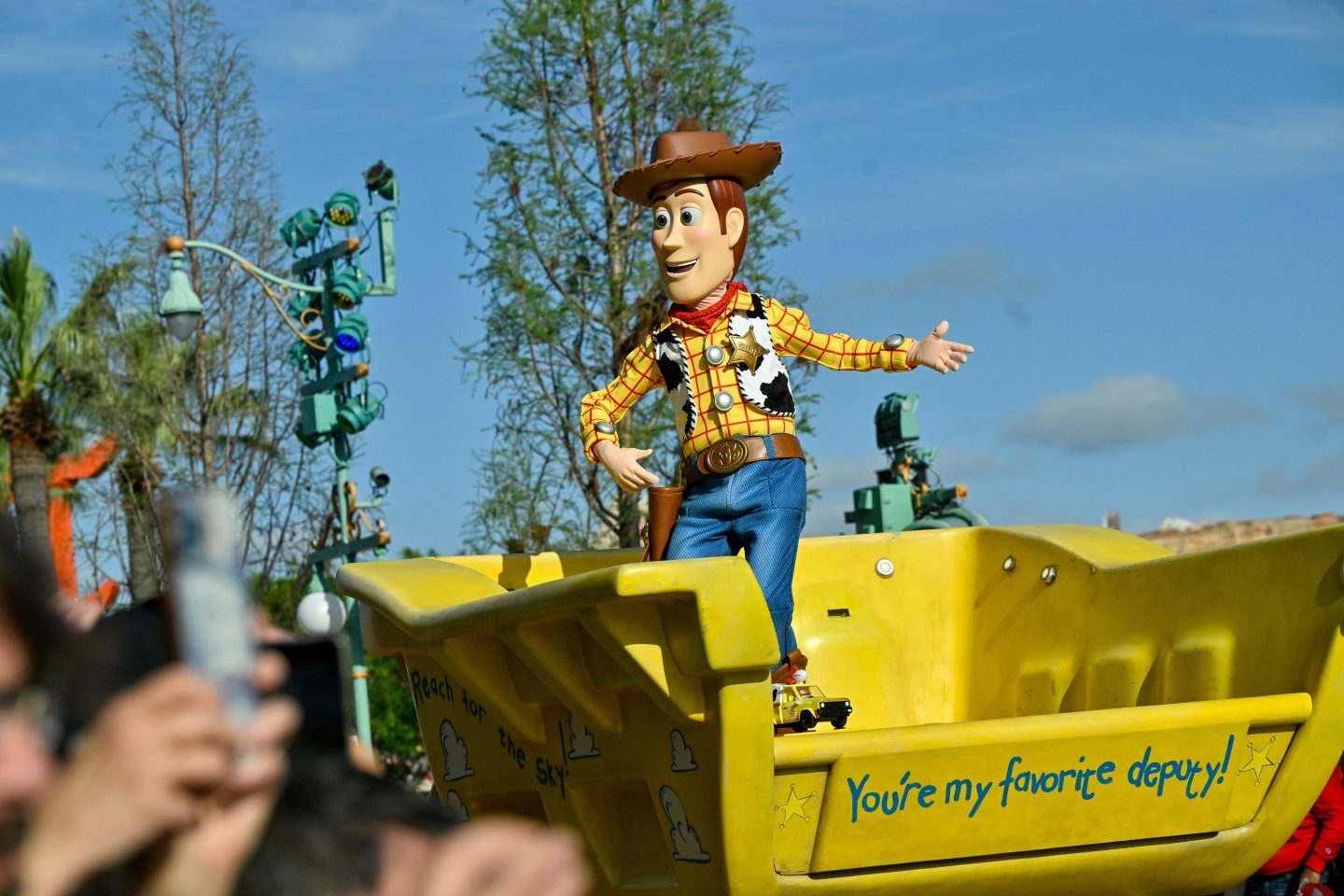 Woody from Toy Story rides in a truck during the "Better Together: A Pixar Pals Celebration!"