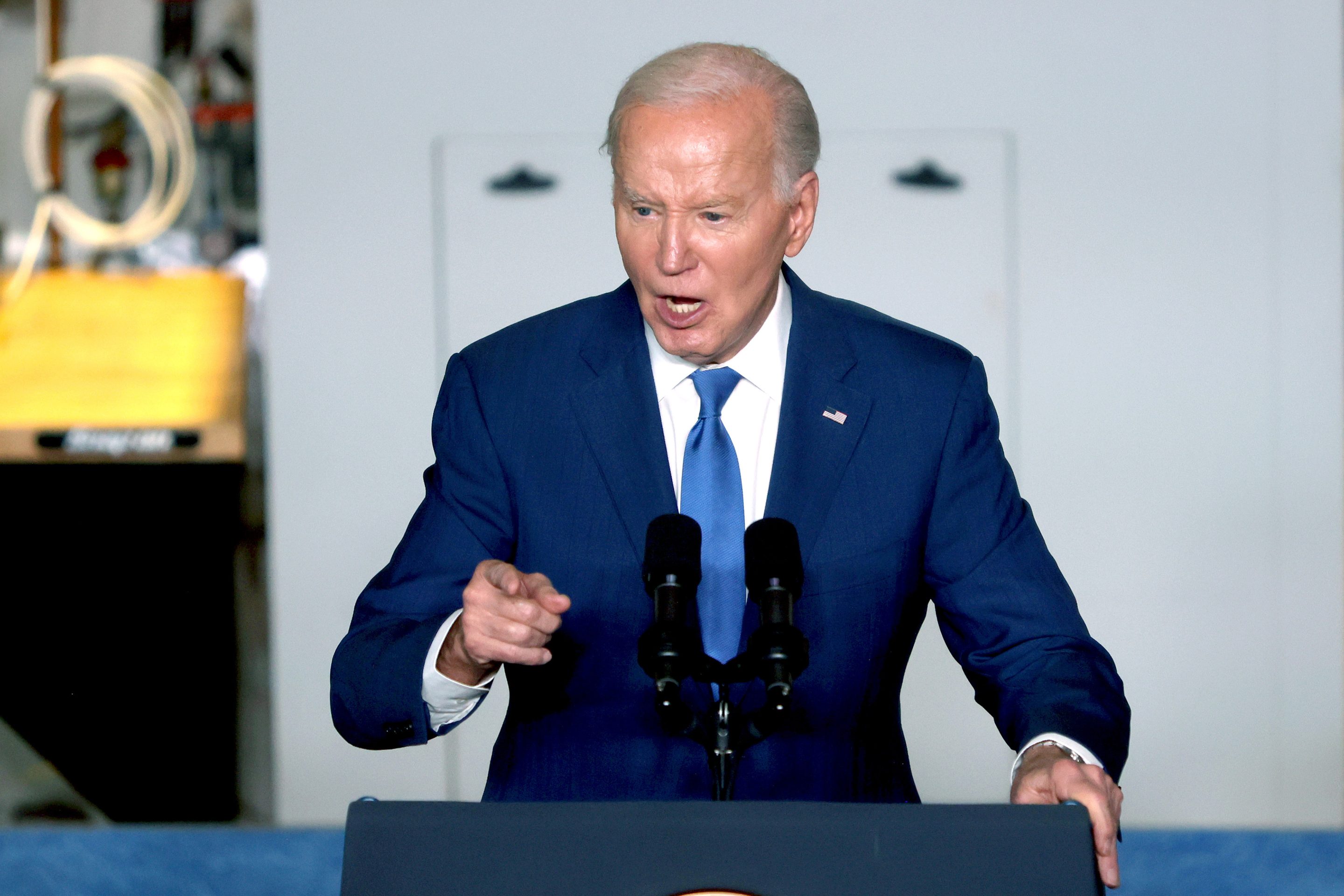 Joe Biden speaking at a podium.