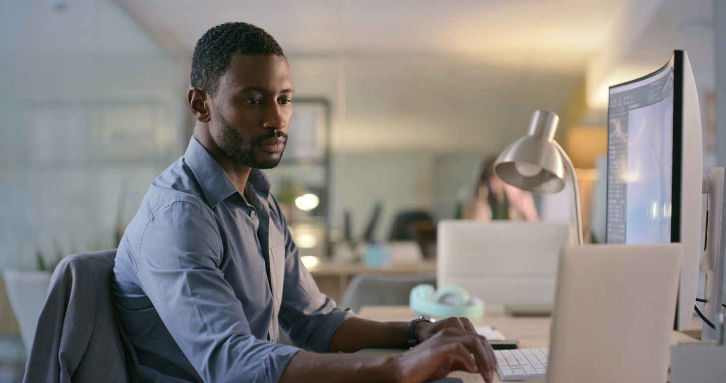 Software designer, engineer or businessman typing on laptop for information technology or cyber security.