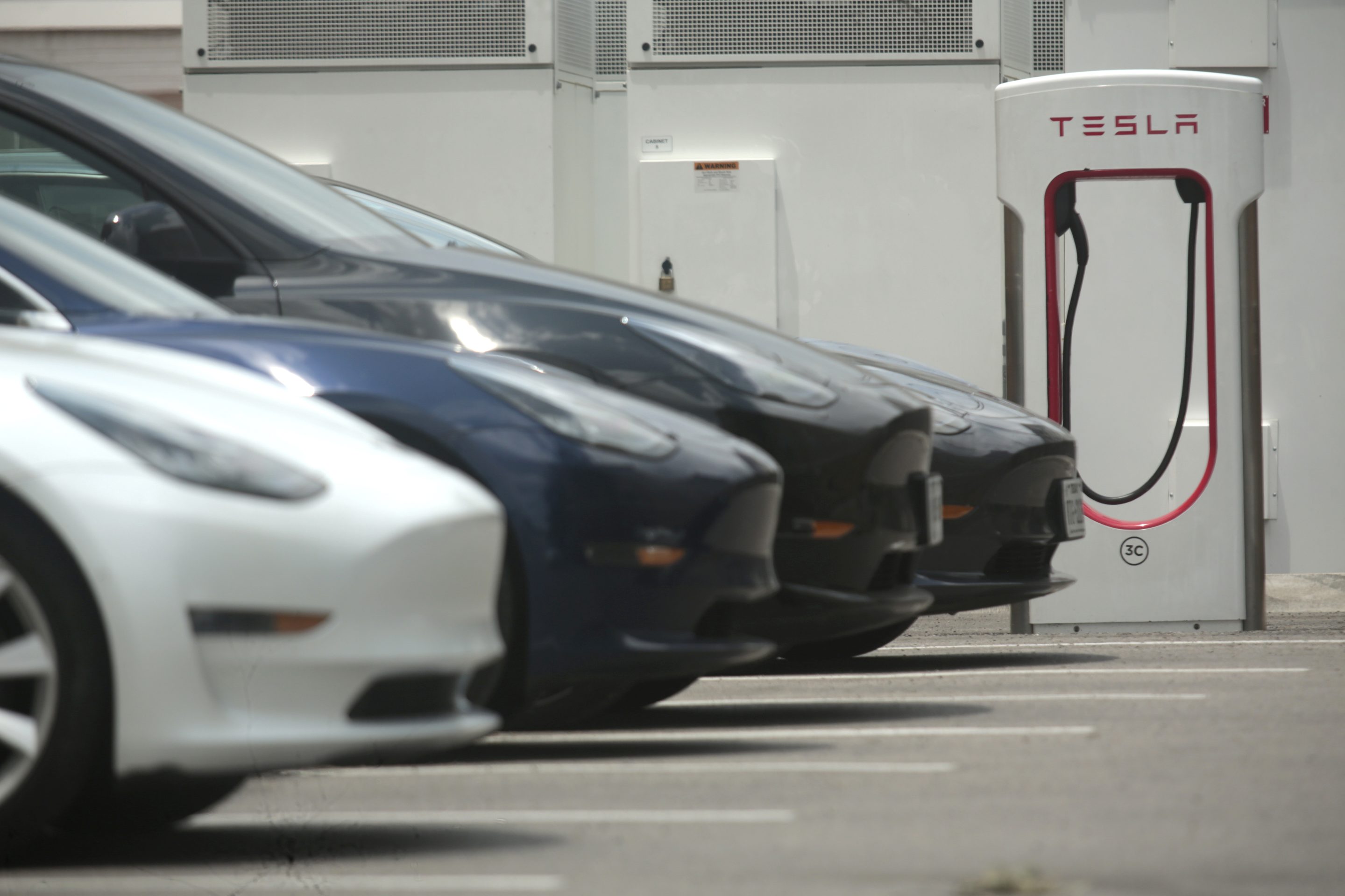 A Tesla supercharging location is seen on Kipling Street, June 3, 2024 in Houston.