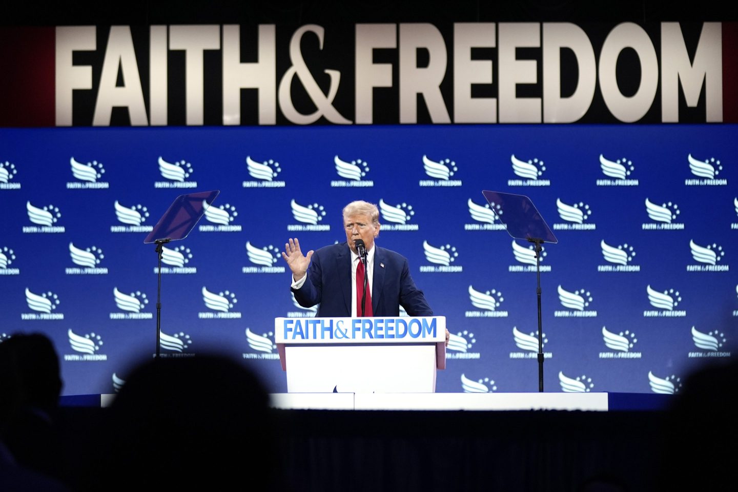 Donald Trump speaks at podium