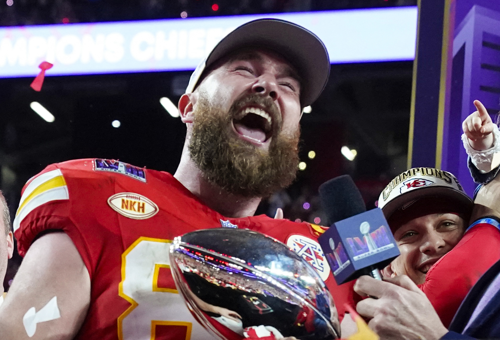 Travis Kelce at a podium