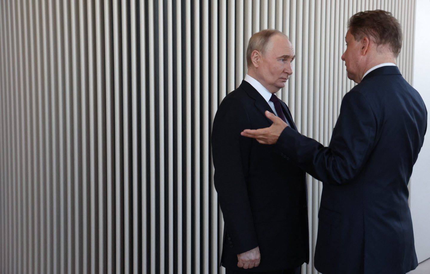 In this pool photograph distributed by Russian state agency Sputnik, Russia's President Vladimir Putin (L) speaks with Russia's energy giant Gazprom CEO Alexei Miller as they visit the Lakhta Centre skyscraper, the headquarters of Russian gas monopoly Gazprom in Saint Petersburg.