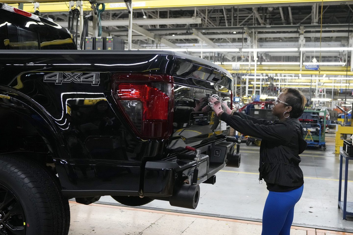 worker works on truck