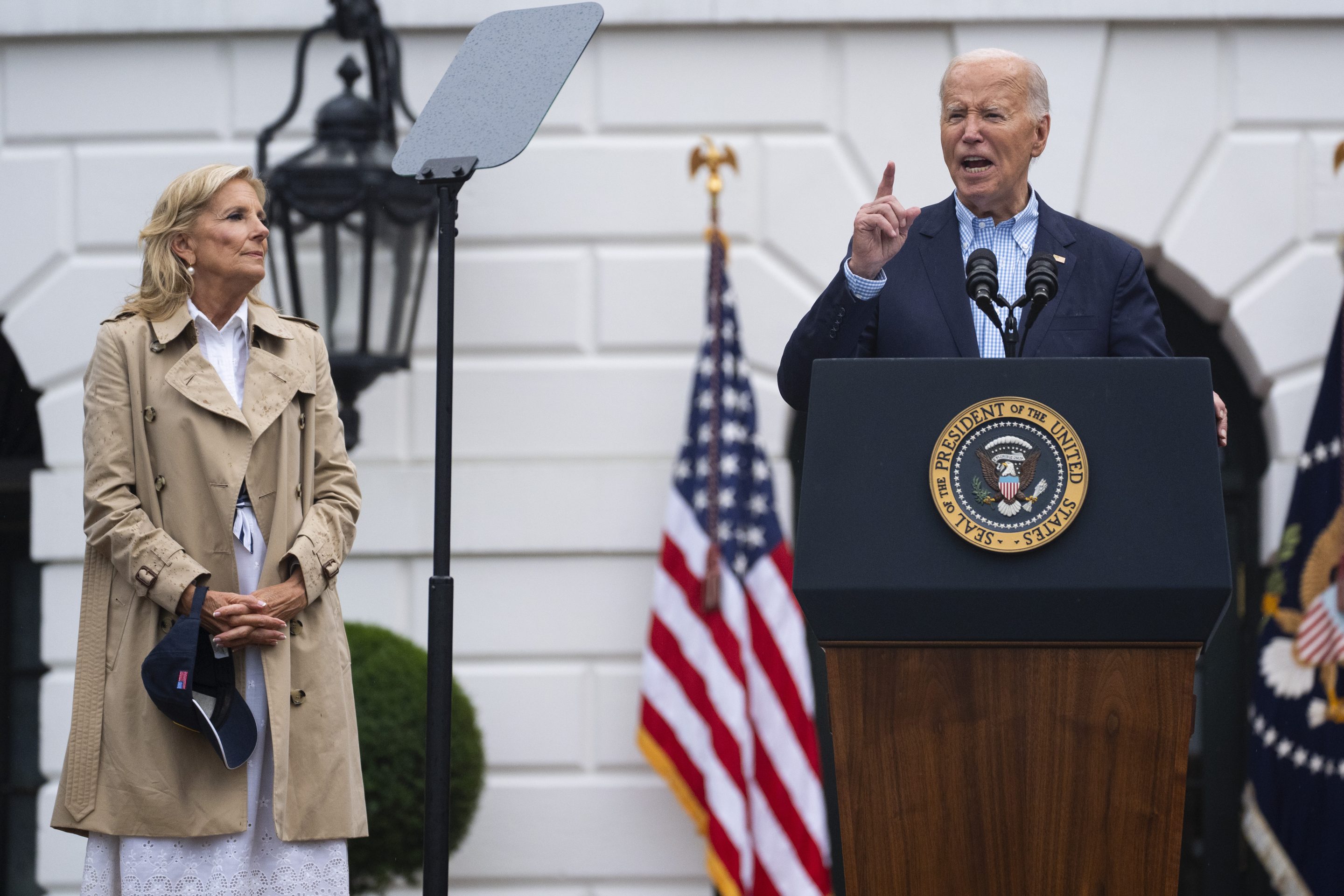 First lady Jill Biden listens as President Joe Biden speaks during a barbecue with active-duty military service members and their families on the South Lawn of the White House, on July 4, 2024, in Washington.