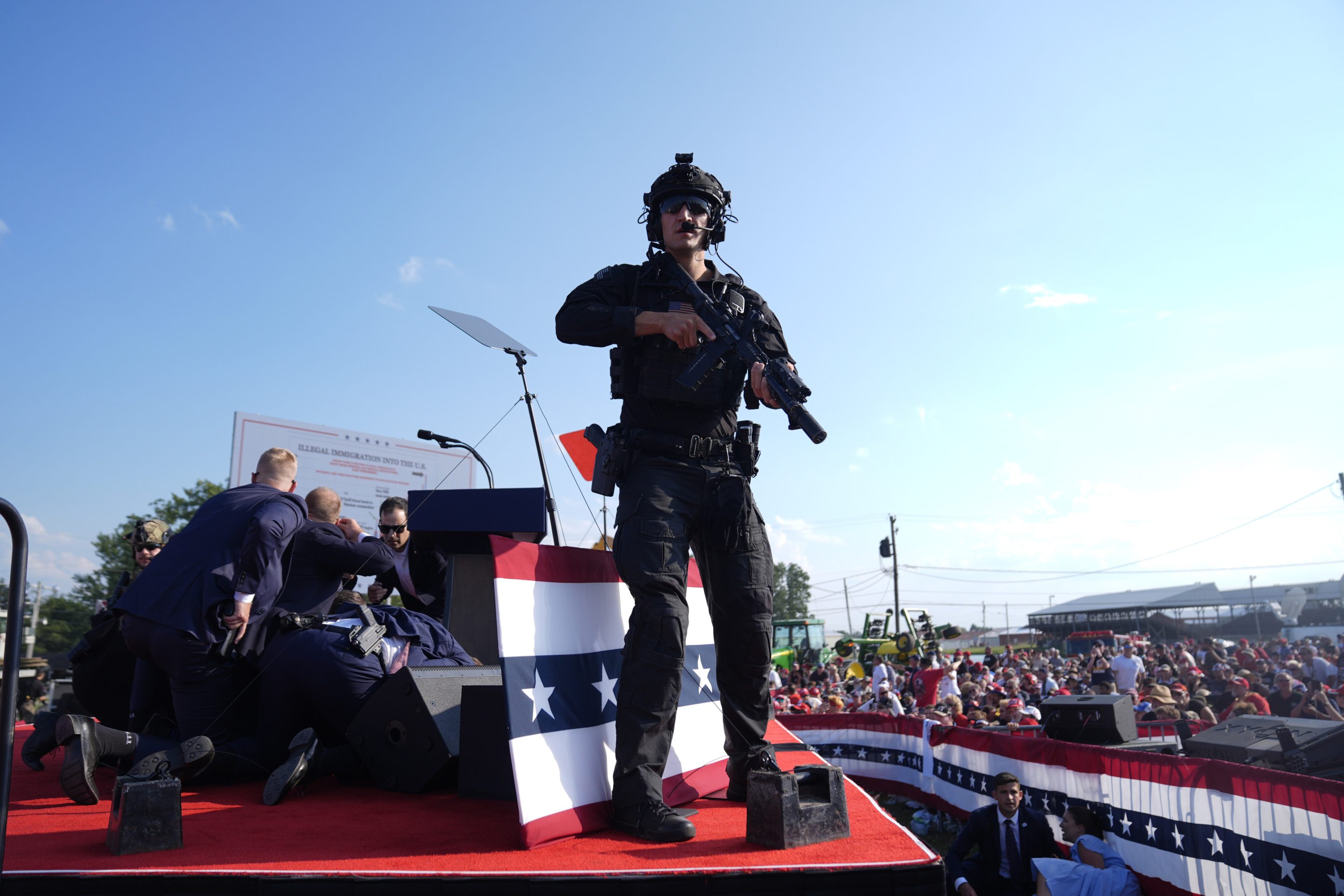 Republican presidential candidate former President Donald Trump is surrounded by U.S. Secret Service agents on stage at a campaign rally, on July 13, 2024, in Butler, Pa. 