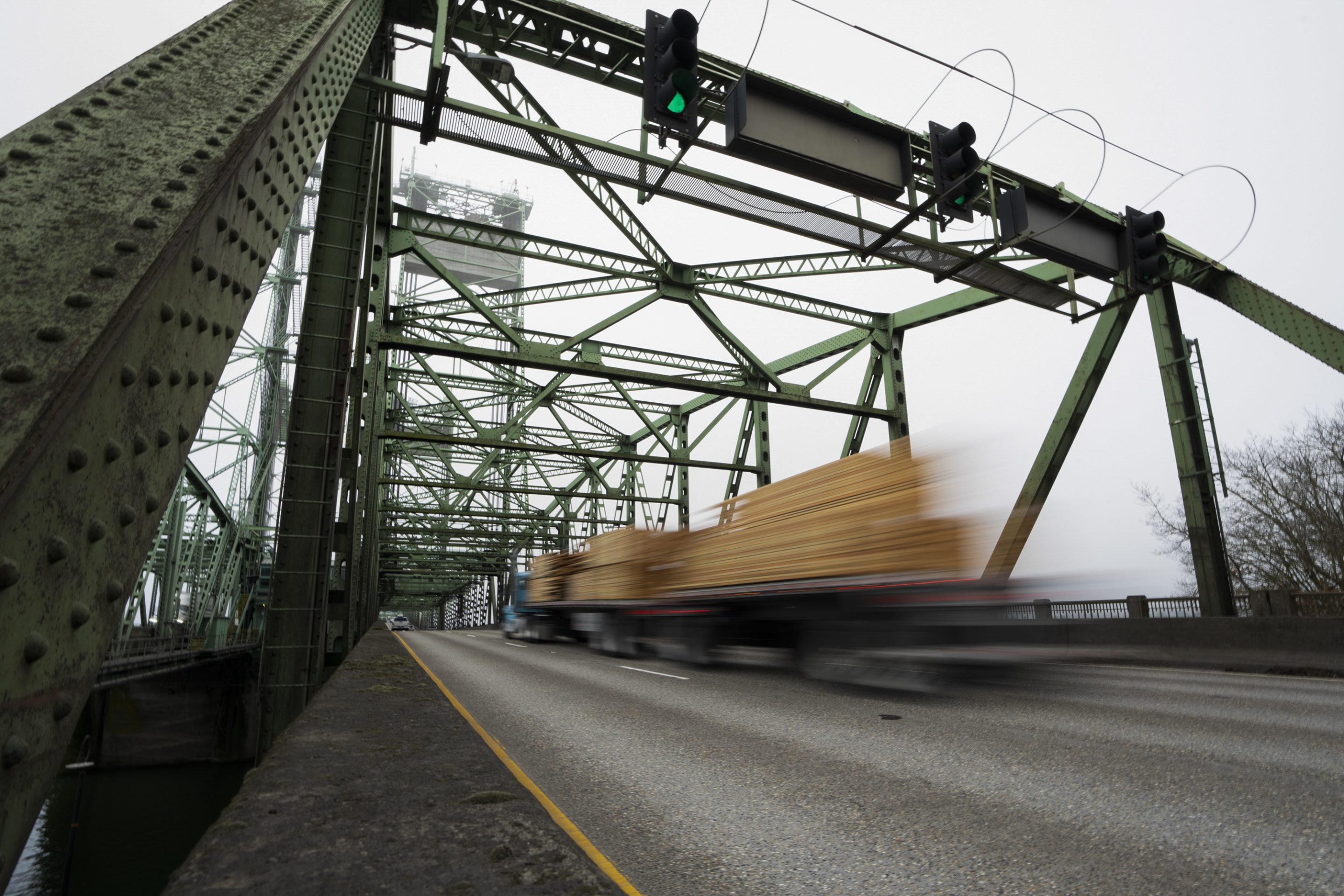 A truck going over a bridge