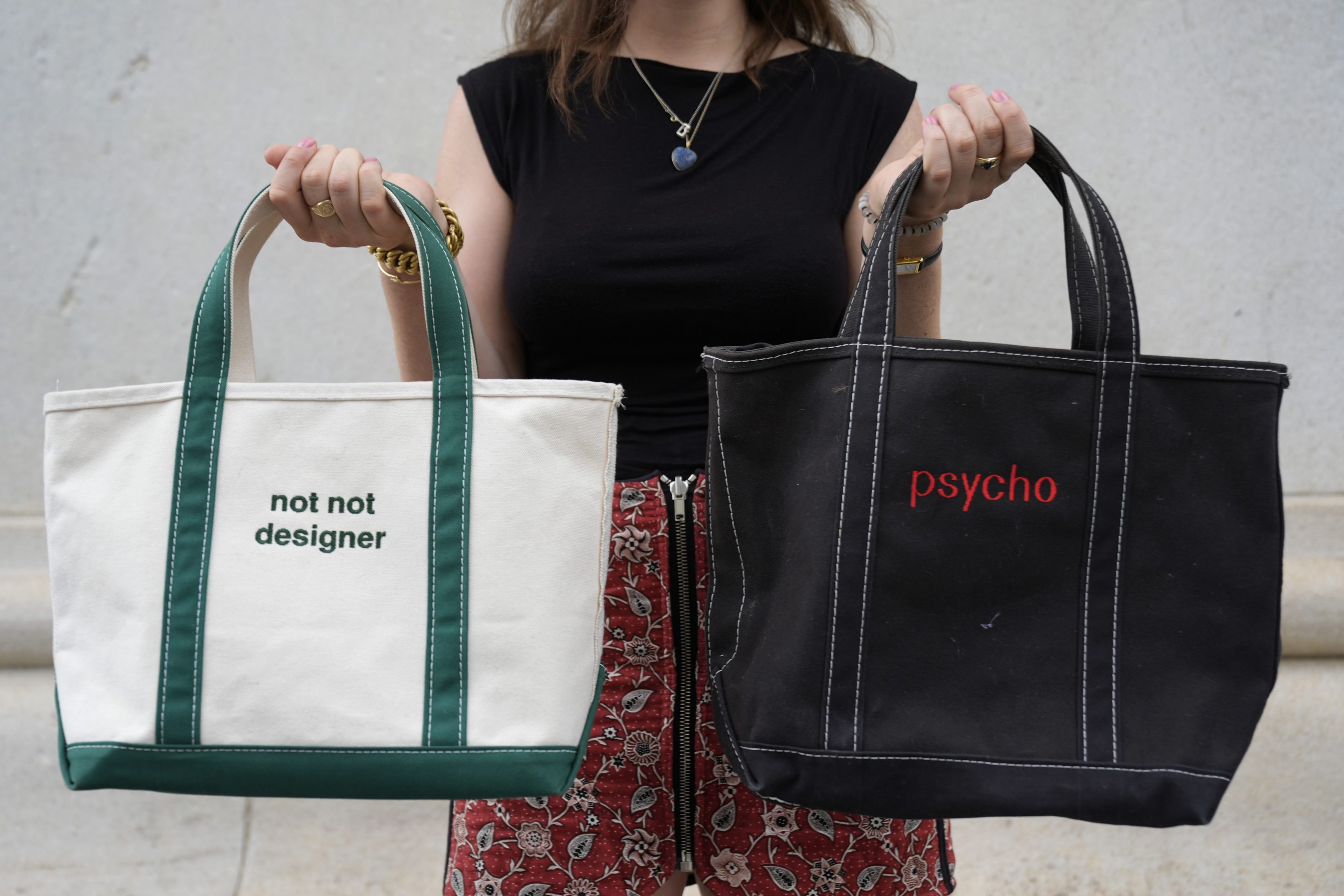 Gracie Wiener poses with some of her tote bags in Washington Square Park in New York, on July 17, 2024.