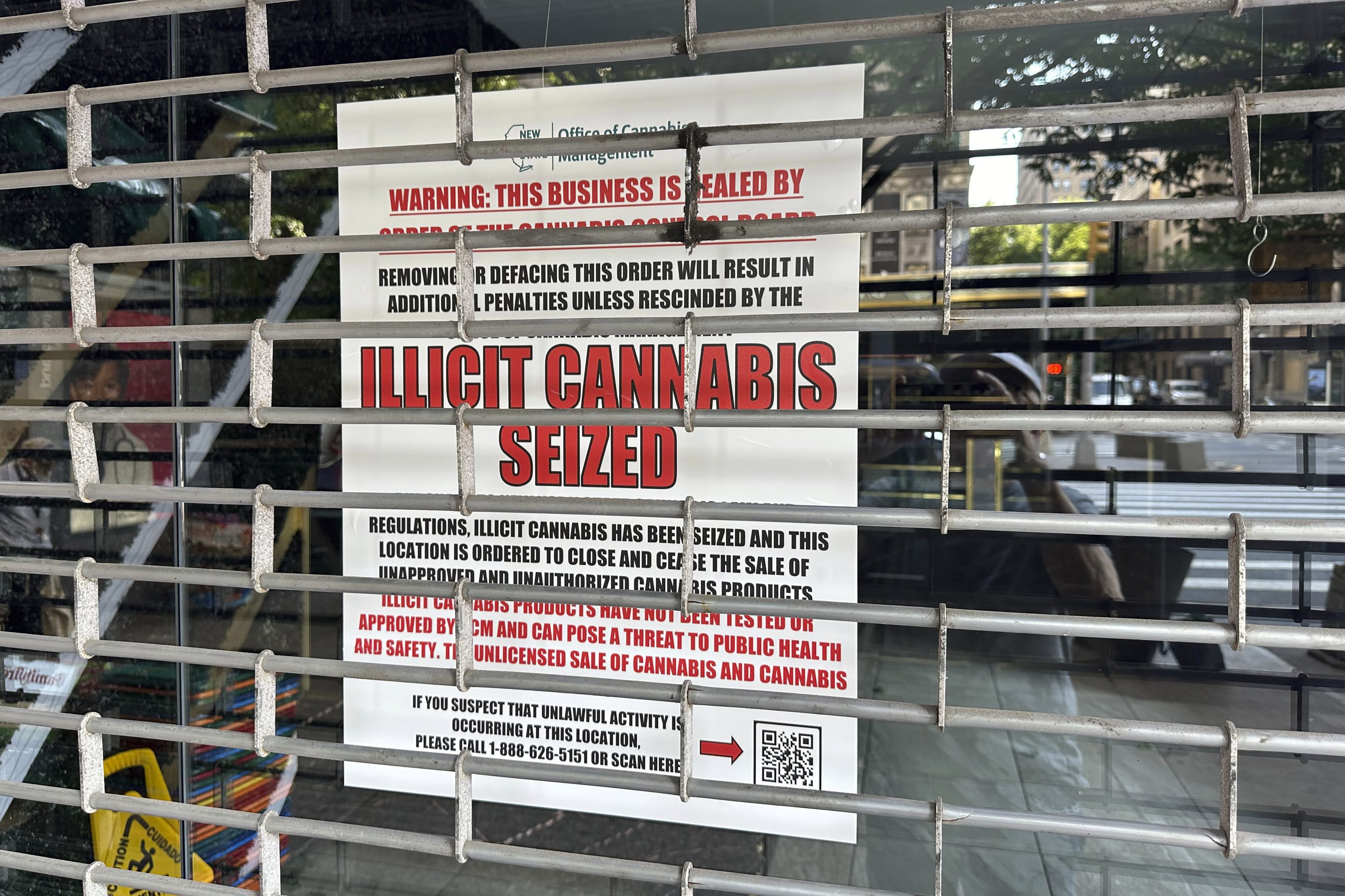 A notice from the Office of Cannabis Management is posted in the window of a closed shop, on New York's Upper West Side, June 21, 2024.