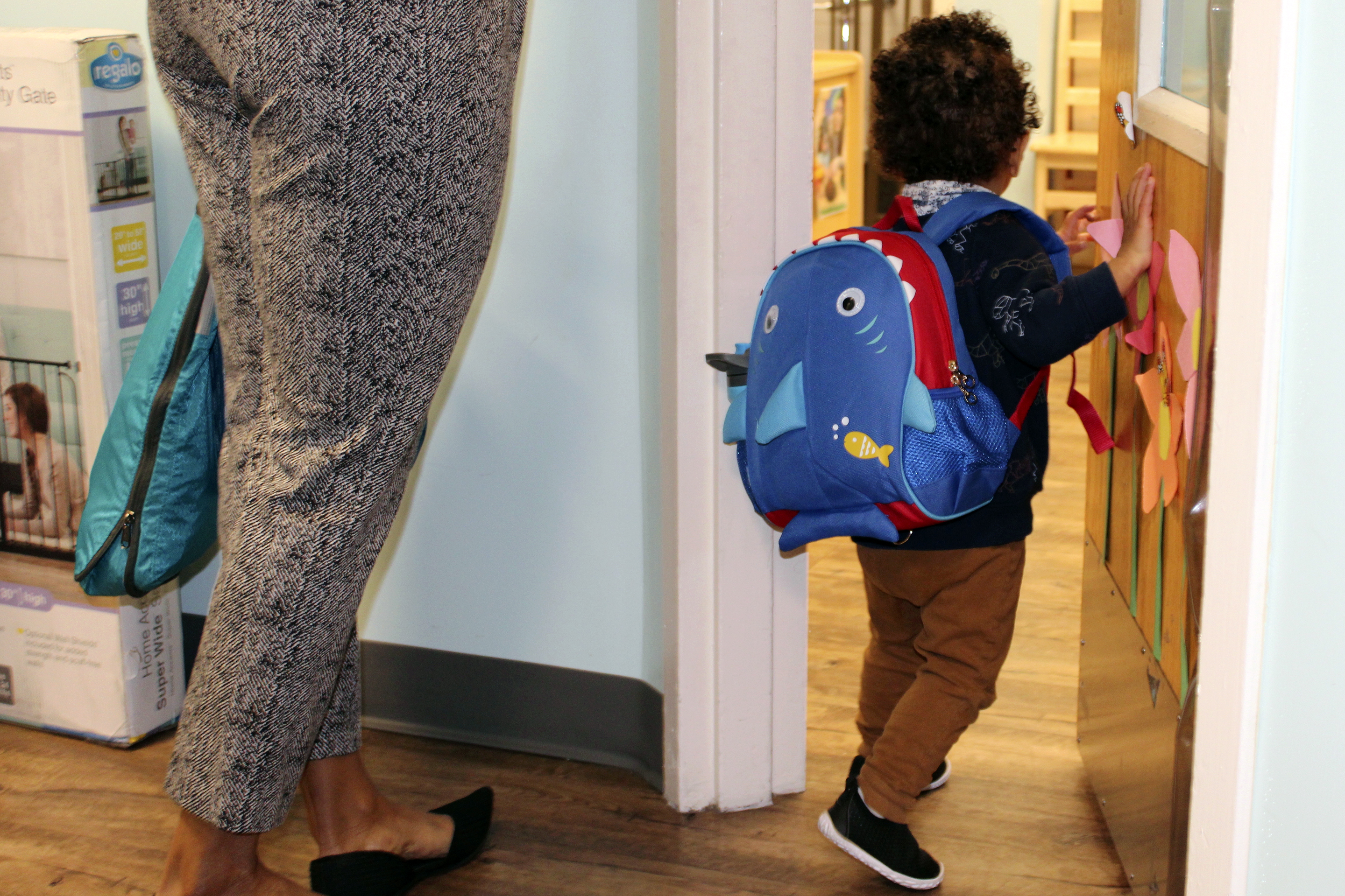 A young boy enters the toddler room with his mother at the KinderCare Child Development Center at The Venetian Resort Las Vegas April 18, 2024.