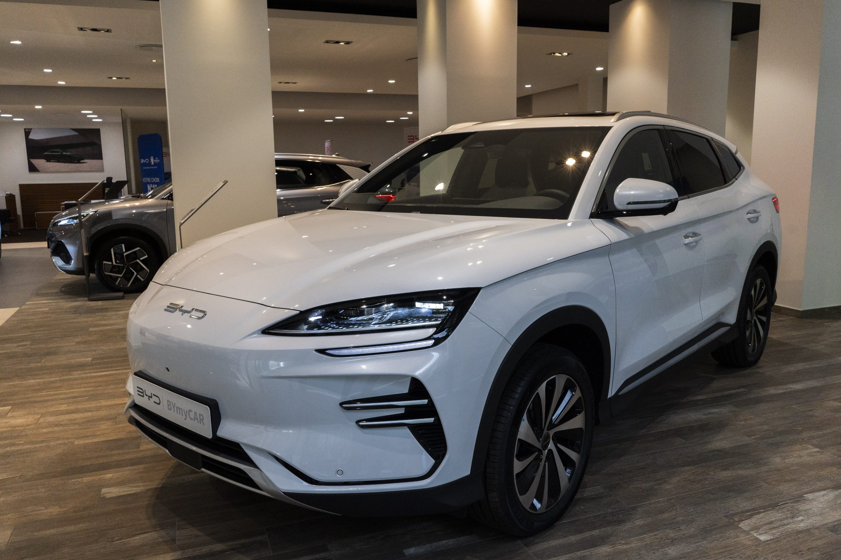A BYD Seal U electric vehicle at a showroom in Paris.
