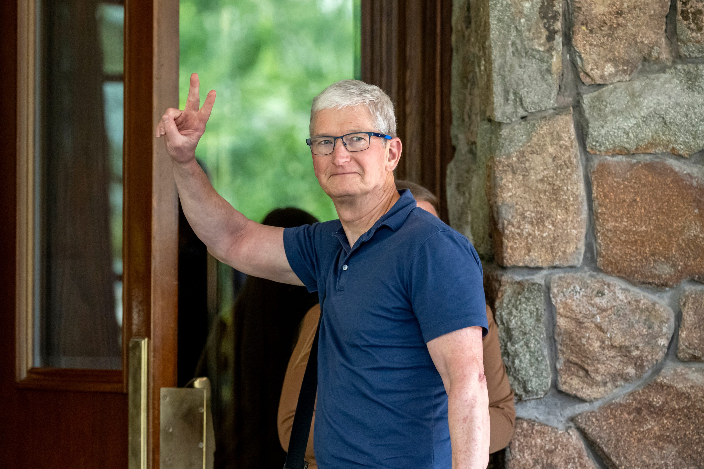 Tim Cook holds up two fingers