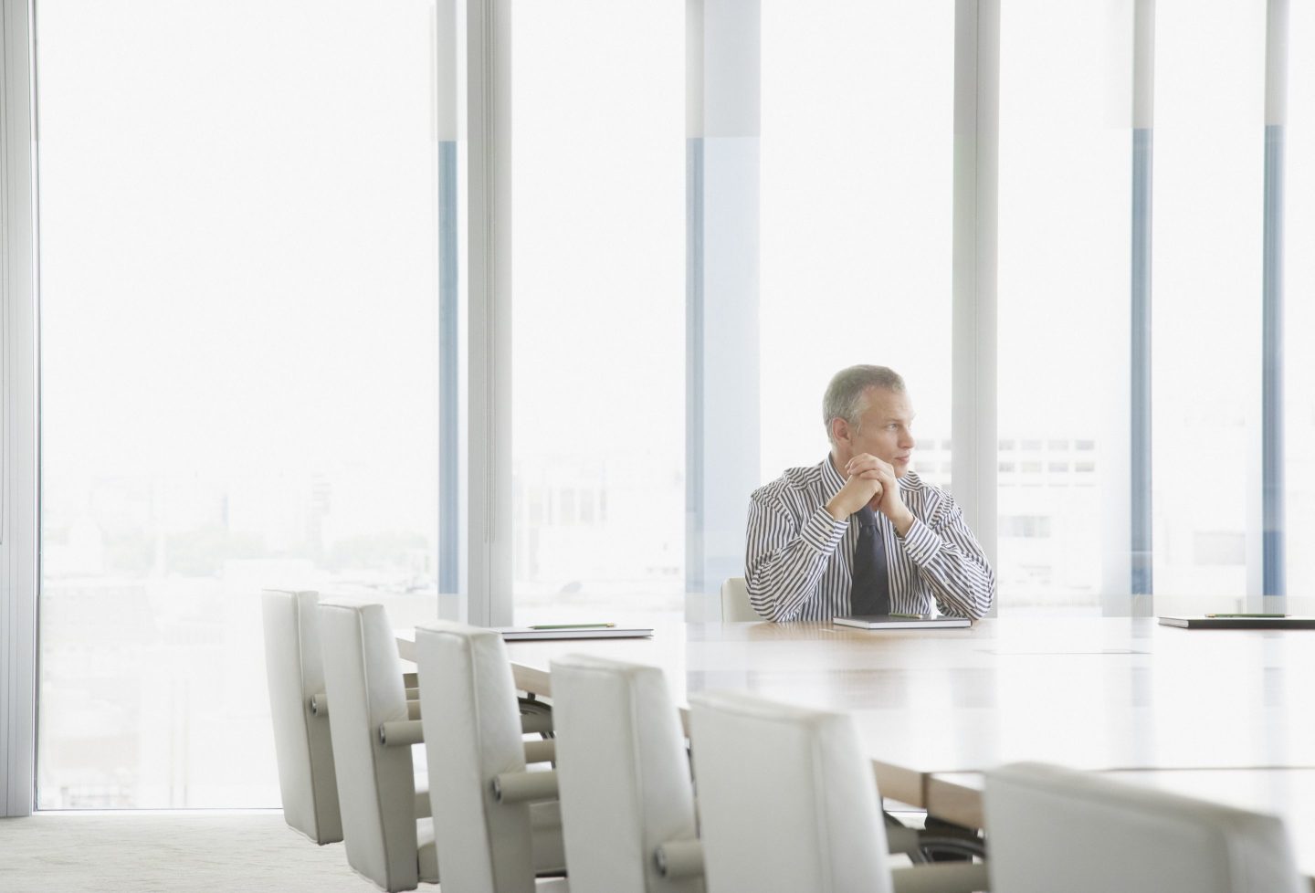 Businessman sitting at conference table