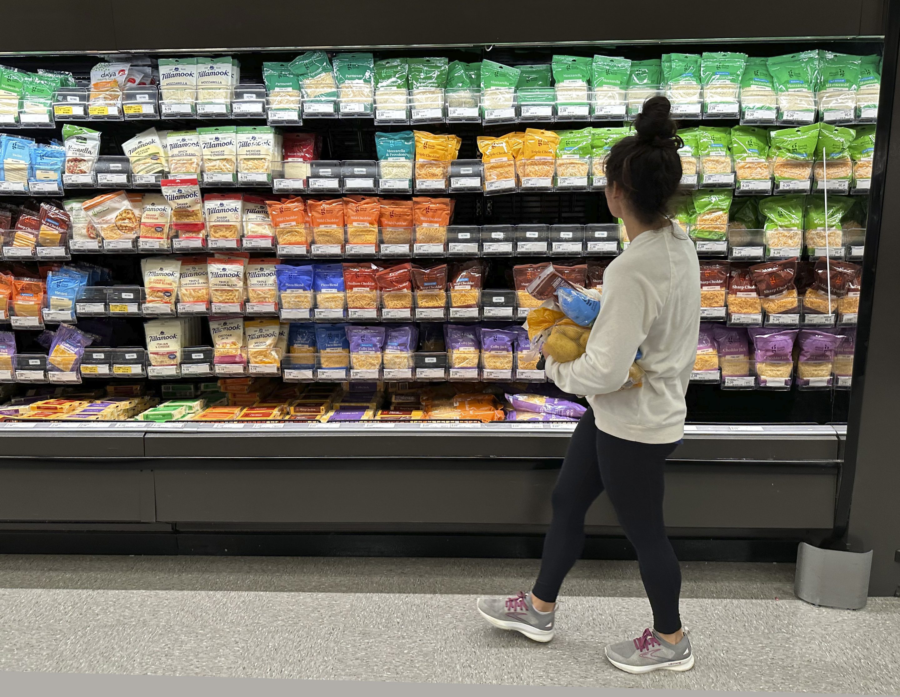 A shopper peruses cheese offerings at a Target store on Oct. 4, 2023, in Sheridan, Colo.